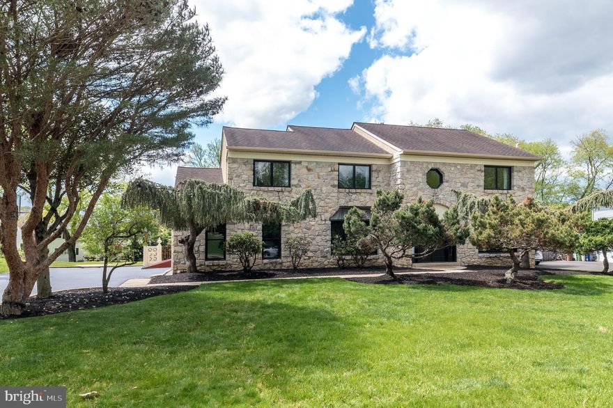 Exceptional 5-bedroom, 2.5-bath Colonial within a fabulous cul-de-sac and walking distance to the shops and restaurants of the Promenade, offering over 3,300 square feet of amazingly reimagined and beautifully updated living space, with hardwood floors & custom millwork throughout. Expertly redesigned on both floors, this home features a completely reconfigured floor plan that embraces an open, airy living style while still providing functionality and comfort. The Entrance Hall features a renovated Powder Room (2022) with vanity with marble counter & marble backsplash. The Living & Family Rooms are open to each other for excellent entertaining flow. The Living Room offers a bay window and doors leading to the Family Room. The inviting Family Room includes a wood-burning fireplace w/full wall of brick surround, a wet bar w/granite counter & marble backsplash, and doors to the rear grounds. This area was wonderfully redesigned so that there are no walls between the Family Room, Kitchen and Breakfast Rooms, providing a completely open area to cook, entertain or relax. The gorgeous renovated Kitchen features a center island w/seating for 4, granite counters, stainless oversized sink, stainless appliances including a Bosch dishwasher, Viking 5 gas burner range w/Viking hood, marble backsplash, custom soft-close cabinetry and an included French door refrigerator. The sun-drenched adjacent Breakfast Room offers a vaulted ceiling with exposed beams and skylight. Doors from the Kitchen open to the Dining Room with 2nd bay window. The spacious Laundry Room includes the washer and dryer plus utility sink, cabinets and door to 2-car Garage. A turned hardwood staircase leads to the fantastic, reconfigured 2nd floor that turned 4 bedrooms into 5 without compromising space or functionality at all. The entire floor features newer hardwood floors (2022). A wide hall, perfect for bench seating, welcomes you to the luxurious Primary Suite featuring the Bedroom w/cathedral ceiling, exposed beam & 2 professionally organized double door closets plus one walk-in. The stunning, resort-like renovated Primary Bath (2022) includes a stand-alone cast-iron Kohler soaking tub, spa shower w/frameless glass door and 2 shower heads, & vanity w/marble counter and 2 porcelain sinks plus linen closet. There are 4 additional spacious bedrooms, 2 with walk-in closets and 2 w/double door closets. The renovated Full Hall Bath (2022) is equally gorgeous, with tiled floor, vanity w/marble counter & 2 sinks and cast-iron soaking tub w/shower & sliding glass doors. Another fantastic feature offers pull-down stairs from the hall to the floored Attic with lighting, built-in shelving, hanging rod and table, to provide ample additional storage space. The basement is the most amazing unfinished basement imaginable, with a colorful high-gloss epoxy floor in Upper Dublin school colors. It is a Recreational Masterpiece, complete w/fantastic, commercial grade inclusions that could keep anyone occupied for days. Watch your favorite TV show or sporting event on the included TV while shooting pool on the antique Brunswick pool table, or play foosball or air hockey. Then, exercise on the recumbent bike, lift weights, or work out with the punching bag or the Power Tower. Also included in this amazing space are: 2nd refrigerator, workbench, bike rack, cabinetry and shelving. Bilco doors provide easy access to add or remove anything from this space. 2 sets of doors from the 1st floor lead to the fantastic rear yard with lighted Patio and separate area for barbecue and food prep. The oversized, recently resealed driveway includes an adjustable basketball hoop. Other special features include all new full-frame windows & doors throughout (2022); new hot water heater, and all new light fixtures. Located within highly rated Upper Dublin School District, with access to the Horsham Power Line Trail and so much more. From everyday comfort to unforgettable entertaining, this home has it all.