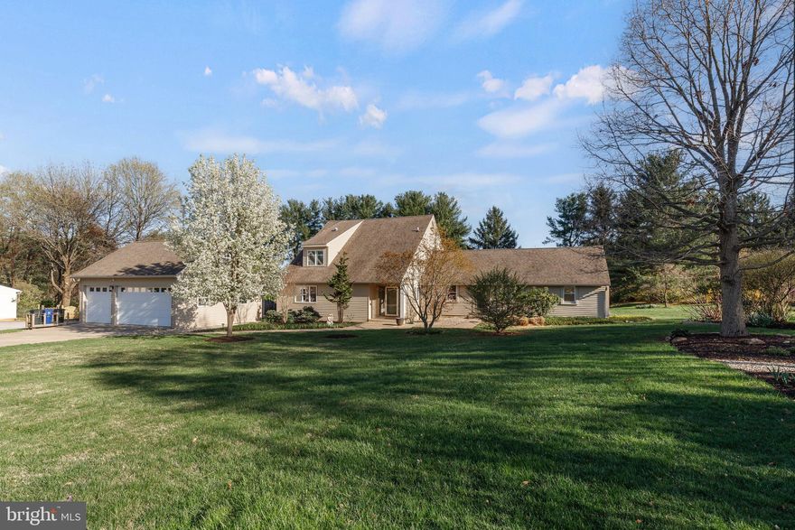 Discover this stunning contemporary residence, meticulously designed for modern living.  A rare first floor in-law apartment includes a separate entrance, a LR, an Eat-in kitchen, 2 BRs, a full bath, laundry and powder room! This offers the occupants privacy while remaining close to the main household. A doorway between the apartment and the main house was once present and could easily be reopened. The kitchen is a chef's dream, equipped with stainless steel appliances, a cooktop, double ovens, and tons of cabinet/pantry space, including an inviting island and breakfast area. The home offers a wealth of interior features, including a jetted tub and a dual shower in the primary bath.  Enjoy the convenience of the main floor laundry and abundant storage options, including walk-in closets and built-ins. A comfortable Sun/Florida room is ideal for your morning coffee! Step outside onto the Trex deck to see the beautifully landscaped 0.91-acre lot, backing to trees for added privacy. The detached garage has room for three vehicles plus additional storage. A great buy in Worthington Valley!