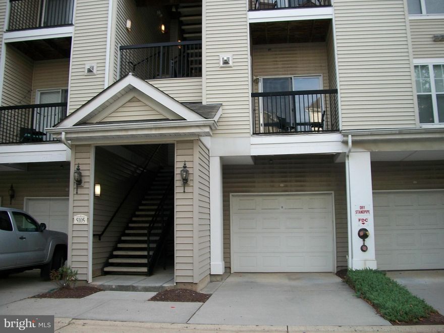Beautifully maintained condo with balcony in gated community ** full size washer and dryer in unit ** garage ** computer niche ** built-in bookcases ** light and bright second floor unit ** move in ready ** club house ** pool ** telecommuting room ** fitness center.  This community has it all.  Short drive to Fair Lakes shops and restaurants.  Easy access to major roads, GMU, Dulles Airport,