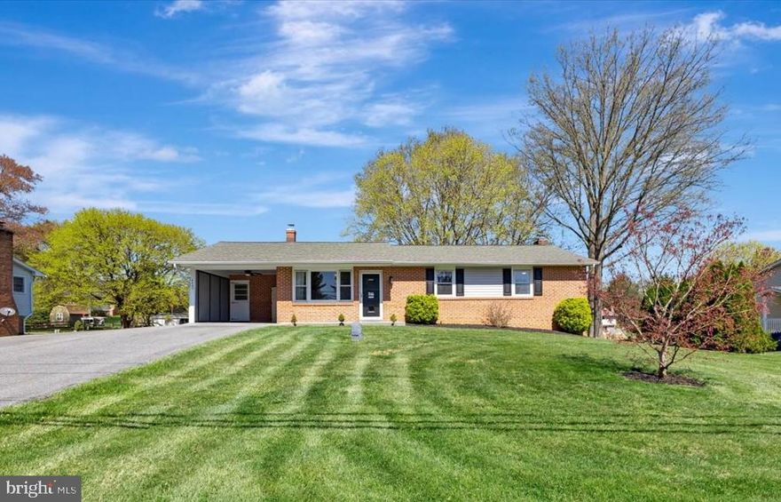OPEN HOUSE THIS SATURDAY APRIL 19th 1-3pm.  This welcoming, beautifully maintained four-bedroom, two-and-a-half-bath rancher in Sykesville is ideally situated on a picture-perfect, half-acre lot. The completely level, fully fenced backyard is ideal for dogs to run, kids to play, and an entertainer’s dream for hosting family and friends. With plenty of room to play ball, add a large playground, or even plan for a future swimming pool, you’ll fall in love with this outdoor space — especially since it backs to beautifully maintained neighboring yards that add to the serene and private feel. Enjoy the brand-new oversized deck with stairs, offering beautiful views of the yard and neighboring yards, a walk-out basement, a rear patio, double-wide driveway, and a convenient carport — all adding to the home's fantastic outdoor appeal. Morgan Run Natural Environment Area is just a little over one mile away — a 1,930-acre natural preserve offering winding trails for hiking, mountain biking, horseback riding, and catch-and-release fishing. Located just a quick drive from Century High School and Linton Springs Elementary, and only 10 minutes to both Eldersburg and Westminster. This spacious 2,800 sq. ft. rancher features natural gas heat and central air (2015), along with a long list of updates and amenities, including: roof shingles, gutters, and downspouts (2017), oversized deck (2025), and a partial brick front with brand new vinyl siding. Inside, the main level showcases beautiful hardwood floors, a spacious kitchen with brand new wall oven and access to the deck, fresh paint in many rooms, a formal dining room, and a bright eat-in kitchen. The lower level is nicely improved with a spacious open family room, brand new luxury vinyl plank flooring, a cozy brick bar, a walk-out Andersen slider to the backyard, a half bathroom with potential to convert to a full bath, a wood-burning fireplace with brick accent wall, a bedroom with a window and a closet, and a large storage room. Additional highlights include crown molding, chair rail, ceramic tile flooring, an updated water heater, new well pump (2022), updated 220-amp electric panel, and a water treatment system. This lovely home is just down the street from "Red Barn Ranch" — a favorite for kids’ camps and family events — and offers quick access to downtown Sykesville, Piney Run Park, Freedom Park, and major routes like Rt. 97, Rt. 26 (Liberty Rd), Rt. 32, and I-70. Don’t miss your chance to tour this wonderful property today!