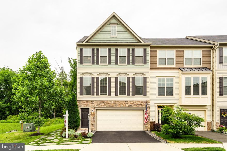 Welcome Home to this peaceful and one of a-kind-town homes.  The owner has spent close to $30,000 on special features and upgrades that you can appreciate, and it shows how well maintained this property is.  This is built by DR Horton built, Bradford II model with 3-level extension on one of the largest and prime lots.  This beautiful house backs to trees with a view of a pond & surrounded by open parking spaces for your guests and entertaining events.   As you drive to this 4 bedrooms, 3.5 bathroom (3,049 SQ ft) End Unit town house, you are greeted by beautiful landscaping in the front and all around the house.  A huge main level offers you a formal living and dinning room, with a HUGE Gourmet kitchen with granite and all the stainless steel appliances, a large island/bar where you can entertain your family and friends and still have room for table and chairs looing over the deck that faces trees.   The family room has a gas fireplace and plenty of windows for natural lights, and a powder room on the main floor.  Recess lights all through the house and beautifully maintained hardwood floors creates that warm feeling.  On the 3rd floor, you have one of the largest owner's suite with sitting area and his/hers walking closets and a nice size full bathroom with separate shower and soaking tub and double sink vanity.  Bedroom 2 and 3 are down the hall and the large hallway full bathroom with double sink vanity is convenient.  When its time for laundry, you don't have to haul them down to any other floors, as your laundry room with a special-order custom-color RED Whirlpool electric washer & dryer set is on the 3rd floor which makes is really convenient and easy.  As you go to the lower level, you have the 4th bedroom and 3rd full bathroom plus a huge living space that has been refinished floors with impermeable Sparta Cote Metallic PURE with Non-Skid Additive perfect for high traffic usage as well as pets. The sliding door in the lower level leads you to the most peaceful and amazing flagstone patio and backyard.   Backyard and the side yard are professionally and tastefully hardscaped with flag stones and an in-ground gas fire pit with decorative blue crushed glass and black aluminum fencing with a gate.   This property has the PERFECT set up for both indoor and outdoor entertaining that is relaxing and peaceful for you and your guests.  New fresh paint on Foyer, lower level, & newly sealed driveway.