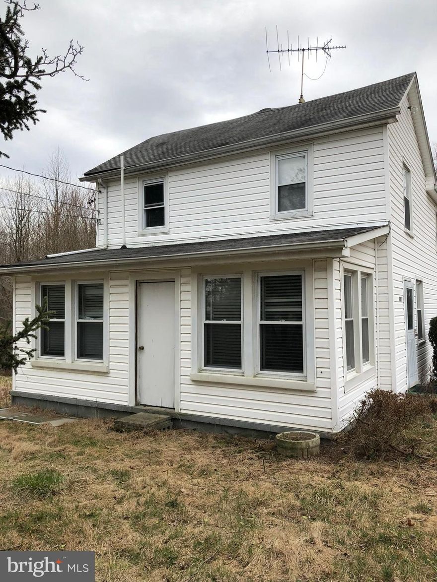 Needs full renovation. Subject to third party approval. Possible shared easement for access. Buyer responsible for clean out after settlement. Being sold as-is.