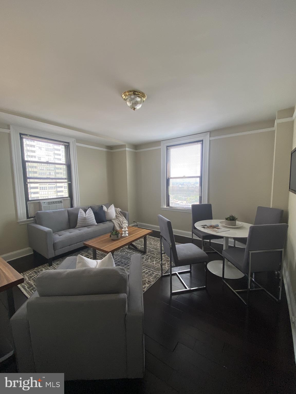 Bright and sunny corner 2 bedroom, 2 bathroom steps from Rittenhouse Square at The Carlyle. This home features beautiful natural light, great entertaining space, hardwood floors in the living areas, and updates throughout. The open great room has ample space for multiple furniture layouts. There is a separate dining area adjacent to the kitchen which is perfect for entertaining. The updated kitchen has ample white shaker cabinetry, granite countertops, white tile backsplash, stainless steel appliances, and a tile floor. Both bedrooms are generously sized and enjoy great natural light, excellent closet space, and ensuite bathrooms with tub showers. There is an in-unit washer/dryer. The Carlyle is a pet-friendly, doorman building only one block from Rittenhouse Square. Rent includes the security of a 24-hour doorman and use of the building's state-of-the-art gym. Tenants are responsible for all utilities.