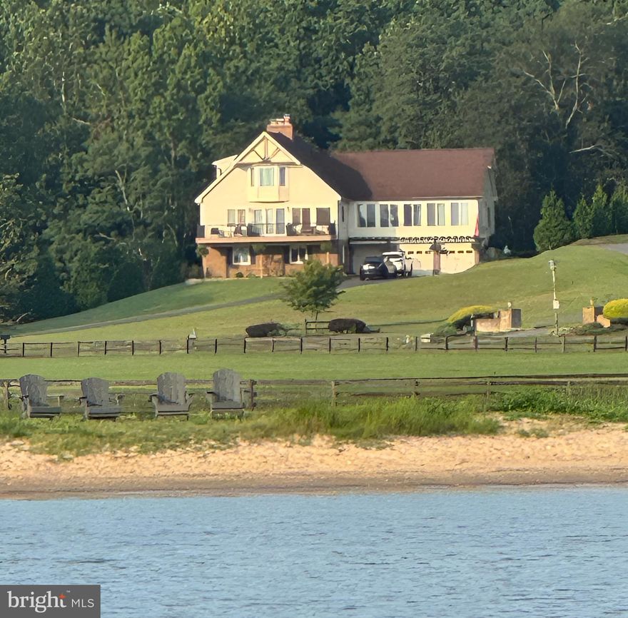 Welcome to this stunning private bayfront retreat at the heart of a picturesque waterfront community along the Chesapeake Bay. Completely renovated with luxury finishes throughout, this home delivers sweeping, panoramic water views from every room.

The expansive sunroom features a dramatic wall of windows that frames the ever-changing bay like a living artwork. Wake to breathtaking sunrises, feel the gentle bay breezes, and enjoy front-row seats to boats heading to the marina, sailing school in action, passing cruise ships, and Herrington Harbor's spectacular fireworks displays.

Inside, the chef-inspired kitchen with a large island keeps the cook connected to family and friends. Cozy wood-burning fireplaces on each level add year-round warmth and charm. The luxurious primary suite offers a serene private oasis, while a dedicated guest level with its own living room and bath provides comfort and privacy for visitors.
Step outside to your private beach, which is great for swimming, kayaking, paddleboarding, or simply relaxing by the water. The location offers unparalleled access to deep-water marinas, a scenic bayfront boardwalk, waterfront dining, and the vibrant "Bay Life" lifestyle.

Commuting is seamless with easy connections to Washington, D.C., Annapolis, Northern Virginia, and nearby metro areas. This home is a peaceful escape that feels worlds away, yet remains conveniently accessible. Solar panels for energy efficiency and lower utility costs. 

Whether you're sipping coffee as the sun rises over the water or hosting gatherings with the bay as your backdrop, this home offers the ultimate waterfront lifestyle. Don't miss your chance to own this rare bayfront gem—schedule your private showing today!

Ready to make this your new address?