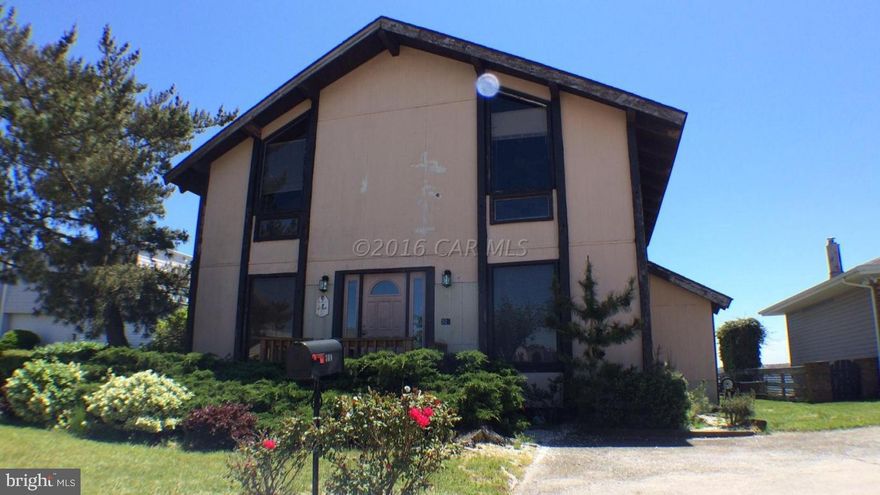 IT'S ALL ABOUT THE VIEW. Property sits on direct bayfront with stunning views of midtown Ocean City skyline. Pull your boat up to this home's own boat slip including boat lift. Great Room is anchored by stunning floor-to-ceiling custom fieldstone fireplace. First floor includes bonus room and office/den. Home wired for intercom/sound system. One owner, never rented. Property sold ''AS-IS.''