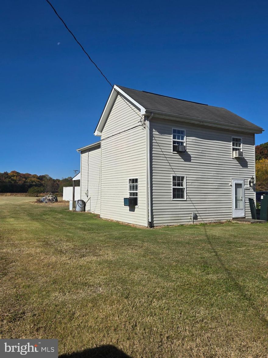 Discover this charming home nestled on just over 1.5 acres of land. With its current two bedrooms and the potential for additional room additions, this property offers versatility and room to grow. The roof is only 2 years old, and a concrete driveway leads to a garage/shop with an attached storage trailer, equipped with electricity, heat, and an air compressor. There's also plenty of additional power for all your workshop needs. With a little creativity in updating floors and paint, you can transform this space into your dream home or a lucrative investment. Plus, it's conveniently zoned VC for added flexibility.