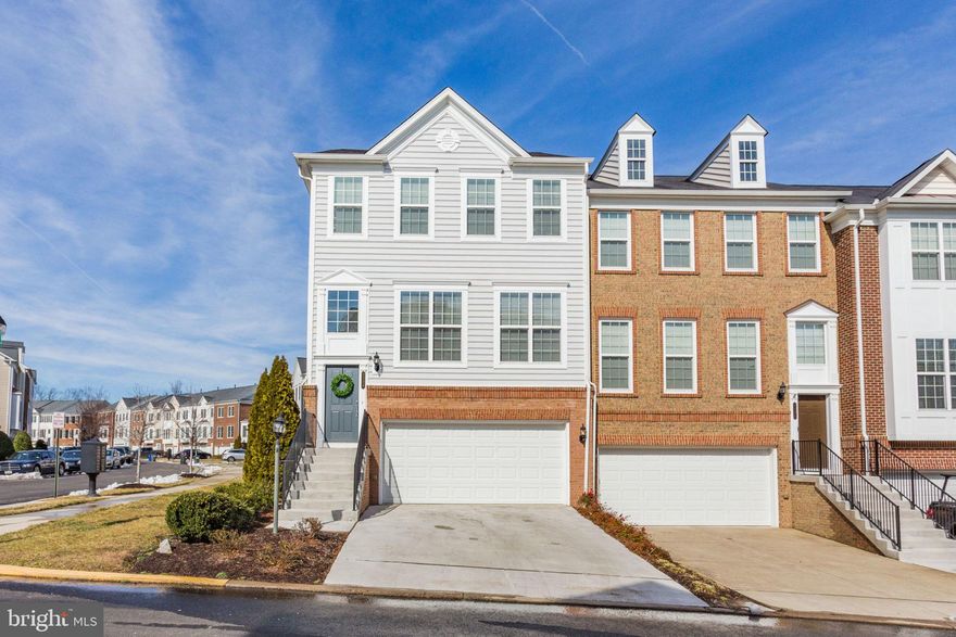 Welcome home to Potomac Club! Built in 2010 and gently lived in, this sun-lit end unit town home feels like New Construction. Enjoy an open floor plan with gleaming hardwood floors and designer paint. The Kitchen has all the builder upgrades; custom backsplash, granite countertops, and stainless steel appliances. Flow right into your dining room that has room for a large table, wainscoting and crown moulding. Enjoy some cozy time by the fireplace and high 10ft ceilings on the main level. The spacious master bedroom has tray ceilings with a master bath that boasts upgraded granite counter tops, jetted bathtub, and fully tiled glass wall. Two more generous sized bedrooms on the top level. You will love to entertain downstairs in the bonus/den/bedroom space downstairs. Walk out to grill/BBQ on your private patio. Easily add a fence for even more privacy. This home is truly turn key and ready for you to move in. Large 2 car garage plus full driveway, even more spaces for your visitors. Gated community offers clubhouse, business center, gym, indoor and outdoor pool, rock climbing wall, sauna, playgrounds and more. A stones throw from Stonebridge at Potomac Town Center including Wegmans, Starbucks, Apple Store, Alamo Drafthouse. You can be so close to all of the restaurants, shopping and fun. Easy commute to I95, Fort Belvoir, Quantico, VRE.