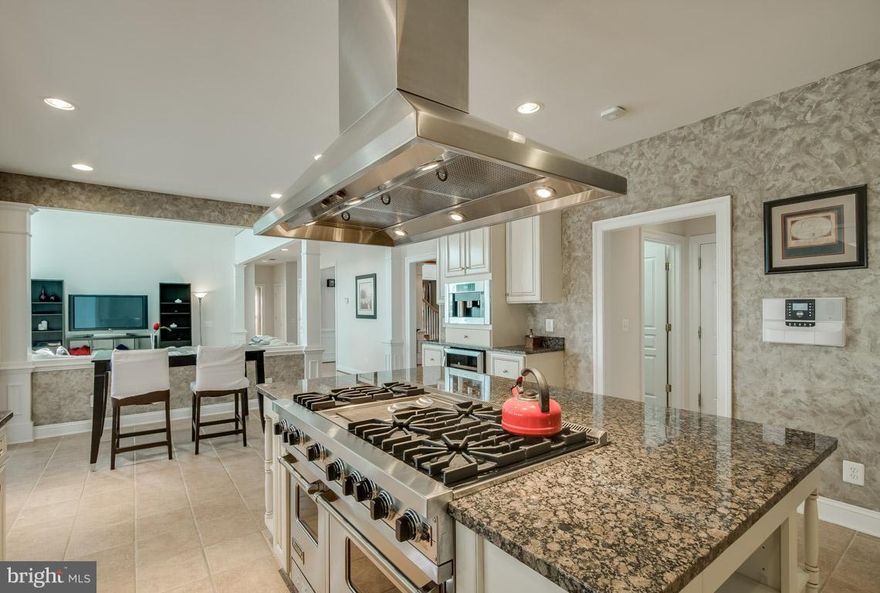 Luxury in Lorton. The sunlight filled grand entry welcomes you to this large 5bd/4.5ba home nestled on a cul-de-sac. A balcony overlooks the sprawling entertaining area, which flows into the gourmet kitchen w/ Viking professional cooktop, ample granite counter top, and a sunroom. The gigantic basement has a custom wine cellar. The plush master suite is the perfect place to relax and unwind.