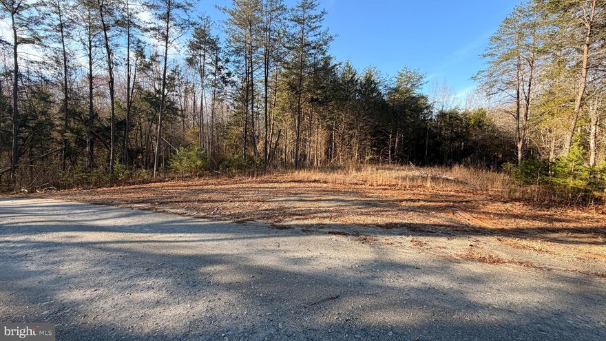 Located at 11415 Honor Ridge Trail in Spotsylvania County, this 10.66-acre parcel offers a private, wooded setting with gently rolling terrain with a beautiful flat area, ideal for a custom home. Surrounded by similar acreage and custom residences in a quiet A-3 zoned area, the property provides both seclusion and long-term value, with natural tree cover creating a peaceful buffer and opportunities for selective clearing to enhance views. the land is already equipped with underground power and access to high-speed internet, removing key hurdles for building. Drain field paperwork in hand for a 4 bedroom conventional septic system with a pump. Conveniently located within a short drive to Fredericksburg, Spotsylvania Courthouse, and Lake Anna, this property offers the perfect balance of rural tranquility and accessibility.
