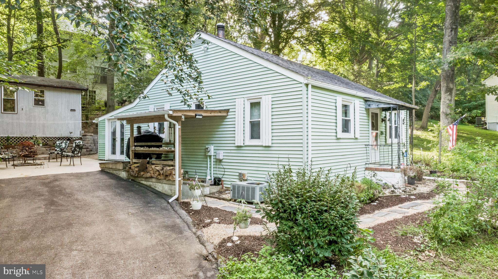 Welcome to 6080 Fir Rd – A Hidden Gem in St. Leonard, MD!
This charming and versatile home offers 1,209 sq ft of comfortable main-level living with an additional 397 sq ft of finished space in the basement — perfect for a variety of uses. This home's ample parking is a rare find in Long Beach thanks to its private paved driveway that can hold 3+ vehicles, and additional off-street parking for 2 vehicles.
Step inside to find a huge, inviting living room, ideal for relaxing or entertaining. The eat-in kitchen provides ample space for casual dining, while the spacious living room allows for additional dining options. Upstairs, you'll find two fantastic bedrooms, and a full bathroom featuring custom stone floors and a beautifully tiled shower.
Downstairs, the finished basement area offers a large flexible space with a full bathroom, perfect for a guest suite, office, or additional living area.
Step outside and discover a backyard oasis! You'll enjoy terraced gardens, a jacuzzi hot tub, and privacy on the bricked patio — perfect for relaxing evenings or weekend gatherings. There's even an outdoor shower hookup in the shed, making it ideal for beach days or gardening cleanup. In the front yard, you'll find 3 raised garden beds and many perennial flowers for butterflies and pollinators!
Other noteworthy things include: a Juliet balcony for attic access, with potential for finishing attic space into an additional room; Built-in cat shelves in the living room (these can be removed/repainted per buyer preference); No HOA, but there is a VOLUNTARY $100/year civic association fee (for association owned beach parking lot access); Deeded access to multiple private community beaches within walking distance from the home; and Association maintained roadways, with a extremely affordable annual road maintenance fee (just $36.90 in 2024).
Whether you're looking for comfort, functionality, or outdoor entertaining space, 6080 Fir Rd delivers all that and more. Don't miss your chance to own a truly special home in this amazing community!