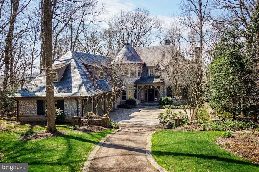 A full panoramic  view of the Potomac! One of the best river views in Merry-Go-Round Farm! Nestled at the end of a quiet cul-de-sac, this craftsman style design is reminiscent of a European country estate. A slate roof, copper gutters, rustic stonework, and moss green trim blend seamlessly with the spectacular wooded setting. Ideally sited there is a welcoming garden courtyard with three car garage and extra parking allowing the rear of the house to have an unobstructed panoramic view of the Potomac River. Exceptional quality and attention to detail is readily evident both inside and out. According to the architect,  Jim Rill, there is not a single architectural detail that was not specifically designed for this house. Extensive use of quarter-sewn oak trim and paneling add warmth and beauty throughout and compliment beautiful stonework, leaded glass accent windows, wood beams and honed Jerusalem limestone floors. From the living room with heated limestone flooring, wooded beamed ceiling, a honed marble fireplace and wall of windows to the dining room which sits in the curved turret,  to the family room with wood beamed ceiling,  stone fireplace, built in cabinetry and three sets of French doors opening to the balcony, every room is exceptional. The "Heart of the Home" is the craftsman inspired kitchen which continues the use of quarter-sewn oak paneling. Exquisite wood cabinetry with wrought brass hardware was designed by Jennifer Gilmore kitchens and is enhanced by granite countertops, tile backsplash and   heated limestone floor. The circular breakfast area overlooks the woodsy backyard and the Potomac River. The perfect place for a morning coffee!A handcrafted quarter-sewn oak paneled staircase leads to the upper level. The lovely master suite takes advantage of the extraordinary view with a wall of curved windows. Adjacent is a magnificent study or sitting room continuing the use of quarter-sewn wood paneling and trim with two walls of built-in bookshelves, a fireplace and windows overlooking the Potomac. In addition there is a bedroom with ensuite full bathroom, a sitting area and craft room with full bathroom that could also become an additional bedroom. A second staircase provides additional access to the first floor.The walkout lower level features a second family room with travertine heated flooring, a fireplace and three sets of French doors opening to a flagstone patio with stone arches overlooking the backyard and Potomac.  Two bedrooms each with ensuite bathrooms, an exercise room, a wine storage area and a storage room complete the lower level.Merry- Go- Round Farm is a special neighborhood with 81 luxury home sites surrounded by 204 acres of common area for shared enjoyment of the natural settings. Residents can enjoy walking trails, tennis courts, three lakes and an equine facility with boarding facilities; lawn care is also included in the HOA fee.