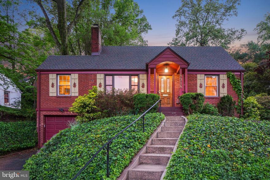 Welcome to this inviting cottage set on a pleasing hillock in the Park Knolls neighborhood of Takoma Park, where covered entry welcomes you in, framed by custom white-oak shutters and blooming plantings! This residence reflects warmth and character, blending original details with thoughtful updates. The home features original architectural details, including hardwood floors and graceful archways, as well as updates such as replacement windows, lovingly landscaped grounds, and an addition that makes for an enjoyable eat-in kitchen
The living room includes a fireplace with glass doors framed with ceramic tile, and a large picture window by Anderson, and opens to the dining room with backyard garden views, which connects to both the kitchen and living room. The kitchen offers maple cabinetry, a gas range with a built-in griddle, tile flooring, and opens to a charming breakfast room with access to the backyard and stone patio. Off the breakfast room is a comfortable family room with a tongue-and-groove ceiling and a pantry. The bedroom wing includes two bedrooms with wood floors and overhead lighting, served by a ceramic tile bath.
Upstairs is a spacious primary bedroom with ample closet space, overhead lighting, and eaves storage. The lower level is unfinished, except for a full bathroom, and provides extensive storage, a laundry area with LG washer and dryer on pedestals, a workbench area, and access to the garage. Recent updates include a new roof (2023), GE appliance suite (2023), and a replaced furnace (2019). The fenced backyard features a stone patio, garden beds, and an attached garage. Located in Takoma Park, the home offers a strong sense of community with convenient access to shopping, dining, and both vibrant Long Branch and downtown Silver Spring.