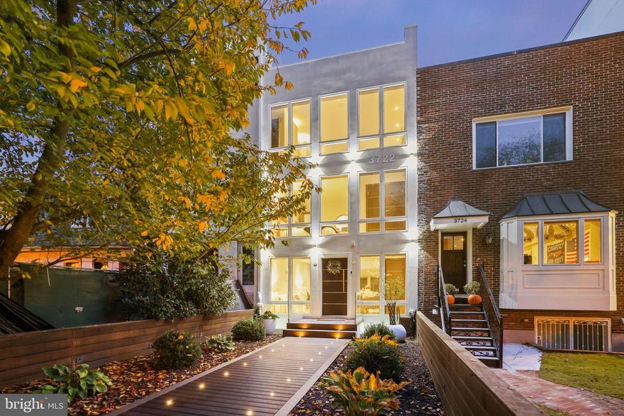 Constructed with quality craftsmanship by Octagon International, this exceptional modern residence embodies the epitome of contemporary design and luxurious daily living. Ideally situated on a tranquil, tree-lined segment of R Street, in close proximity to Georgetown University Hospital, this remarkable property is the perfect setting for elegant gatherings. The open floor plan, with a stunning three-story glass staircase and mezzanine, creates a captivating atmosphere, accented by four expansive skylights that bathe the entire home  in abundant natural light. The main level features a stylish gourmet kitchen adorned with European lacquered custom cabinetry and top-of-the-line Miele appliances, flanked by inviting living and dining areas. A second floating glass staircase leads to the private outdoor terrace. Upstairs, you'll discover five bedrooms, including a spacious private master suite that rivals the finest five-star resorts, complete with a spa-inspired master bath and a private sauna. The lower level boasts an additional en-suite bedroom and comfortable accommodations for family and guests. Generous two-car secured parking, a rooftop patio with a jacuzzi, and panoramic treetop vistas complete this exceptional real estate offering.