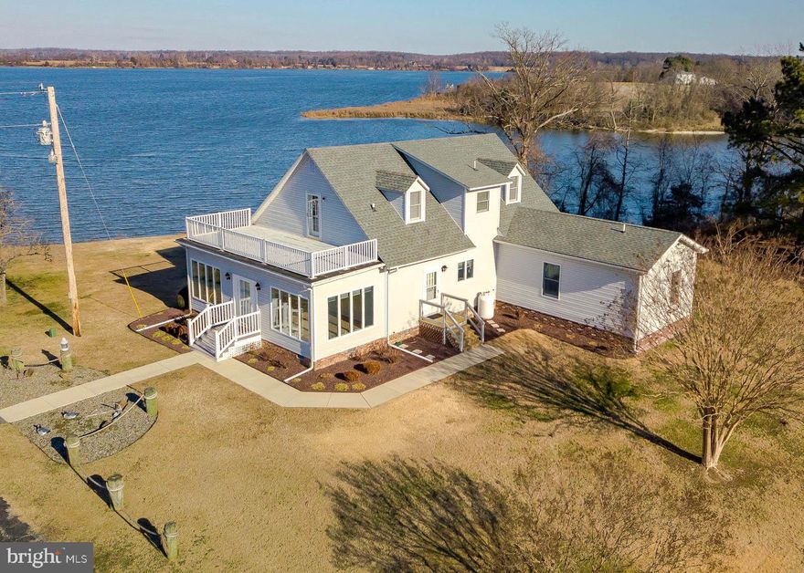 Two parcels totaling 13 acres on the water. Over 300 ft of waterfront for you to enjoy. As you travel through the gated asphalt driveway onto approximately 10 acres of cleared land, imagine what you could do with it all. Start a vineyard, bring the horses, keep it as farmland, install a swimming pool, the possibilities are endless. Country living at its best. The huge metal enclosed tobacco barn, holds 2 cars with a garage door opener and an extra area you can use as you wish. The remainder of the barn can be utilized for animals, a boat or large toys, lots of room for storage. Plenty of paved parking for family vehicles. As you move into the house, the front living space is full of Anderson windows giving you a gorgeous view across the water. Relax in the Sunroom and Living Room with a built-in bar area that will take the stress out of your day. The main level also has a master bedroom and bathroom with walk in closet.  Off the kitchen, a second full bathroom is located on the main level which includes a laundry area that boosts a propane heater for those really cold nights. Upstairs you will find 2 more spacious bedrooms with a full bathroom in between.  A French door off bedroom 3 leads you to a relaxing deck where you can enjoy beautiful sunsets every evening.  Come and see what this wonderful property could offer you!