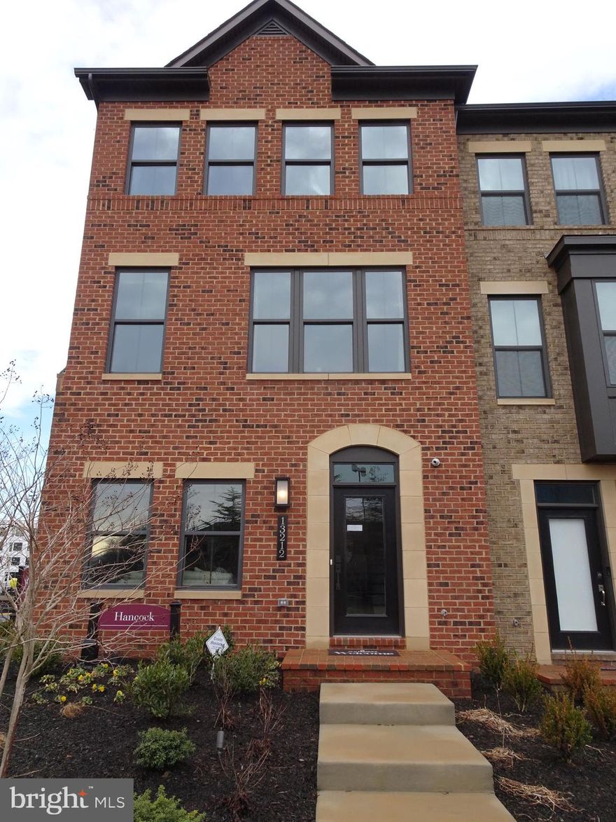 Luxury brand new 4-level 3-bedroom townhouse with 3 full-baths, 2 half-baths, 2-car garage, covered driveway that fits 2 additional cars (4 private parking spaces), 2 18x10 feet decks, granite counter top, full range kitchen appliances, hardwood floor in sitting room, kitchen, and dinning room, and oak staircases. Stainless steel appliances. 6 ethernet ports, 4 cable ports throughout the house.   Walking distance to Herndon Metro Station. 3.5 miles 8 minutes to Washington Dulles Int'l Airport. 0.9 mile to VA267.   Don't miss out this impressive new townhouse that has ample living and transportation conveniences. Hurry before it's gone.