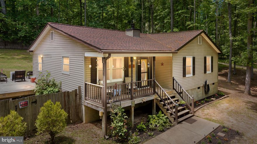 Want the convenience of Fredericksburg while having the acreage and privacy of the country?  Look no further.  Located near the VRE & shopping this adorable rancher style home with recent renovations sits on a 2.46 acre parcel of land.  Situated in a tranquil wooded setting away from the traffic this property offers the perfect blend of privacy and convenience. With a huge detached  2-car garage there's enough room for your toys.  Step inside and  appreciate  the open floor plan that effortlessly connects the living room, dining area, and kitchen but the real treat is the private, fully fenced backyard with a deck.   New roof, New HVAC, New well tank & pump, New carpet, recently replaced hard surface flooring & remodeled kitchen in 2020.  Located in a very private neighborhood with not much turnover, this home offers a peaceful retreat while still being just a short drive away from amenities, schools, and major transportation routes.  Don't miss the opportunity to make this remarkable property your own. Schedule a showing today!