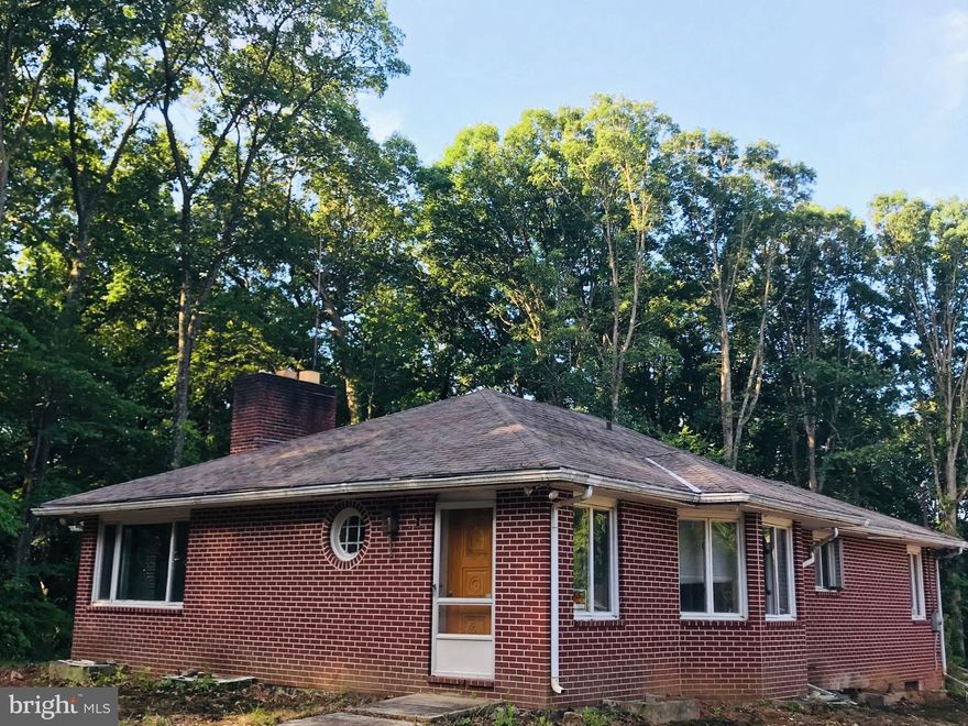 PRICE REDUCED $40K!!!!  "BLANK CANVAS IN THE VALLEY" & GREAT INVESTMENT OPPORTUNITY SITUATED ON 2.21 SCENIC & PRIVATE ACRES IN THE COVETED GREENSPRING VALLEY. THIS 'AS-IS' ALL BRICK HOUSE HAS BOUNDLESS POTENTIAL! ALL THE HARD WORK HAS BEEN DONE AND ITS NOW READY FOR YOUR RENOVATION, TASTE AND PERSONAL TOUCH. THE LONG DRIVEWAY TAKES YOU TO AN OVERSIZED (29X26) GARAGE (ALSO ALL BRICK) WITH 10FT WIDE DOORS AND AN ENORMOUS WALK UP ATTIC THAT COULD BE LEFT AS ABUNDANT STORAGE OR  TRANSFORMED INTO A SEPARATE LIVING AREA, IN-LAW OR AU PAIR SUITE. SINCE THE UPPER AND LOWER LEVEL FOOTPRINTS OF THE MAIN HOUSE MATCH, IT COULD HAVE 5 BEDROOMS (3 UP & 2 DOWN), 3 FULL BATHROOMS (2 UP & 1 DOWN), AN OPEN LIVING ROOM AND KITCHEN THE LENGTH OF THE ENTIRE HOUSE, GAME/REC ROOM AND FULL LAUNDRY AREA.  INITIAL INTERIOR SKETCHES AVAILABLE FOR CURRENT HOUSE OR ADDING A SECOND LEVEL. A TRULY AMAZING OPPORTUNITY TO LIVE THE GOOD LIFE IN THE VALLEY!