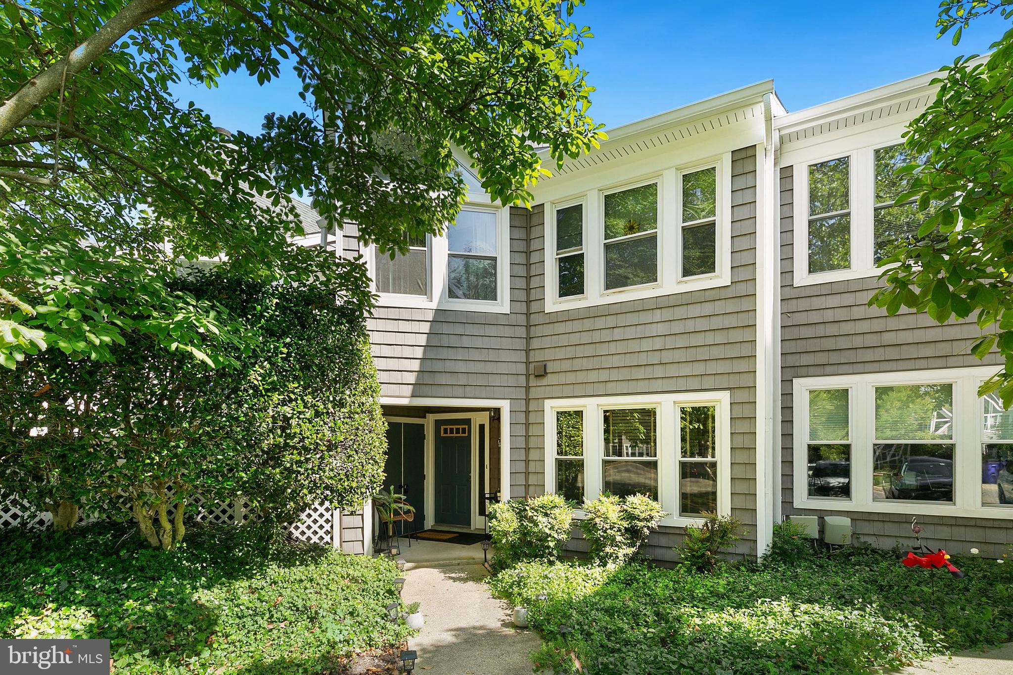 Charming Ground-Level Condo in Woodland Village! This beautifully maintained 2-bedroom, 2-bath residence offers an inviting open floor plan filled with natural light. The spacious living area features warm, neutral tones and flows seamlessly into the dining space—perfect for both everyday living and entertaining. The kitchen boasts crisp white cabinetry, generous counter space, and a convenient breakfast bar. The primary suite includes a private bath and ample closet storage, while the second bedroom is bright and versatile—ideal for guests, a home office, or a hobby room. Both bathrooms are well-kept and designed for comfort. Enjoy the ease of single-level living with no stairs, plus access to community amenities including a pool, tennis courts, and scenic walking paths. Set in a beautifully landscaped neighborhood just minutes from major highways, shopping, and dining—this condo blends style, comfort, and unbeatable convenience.