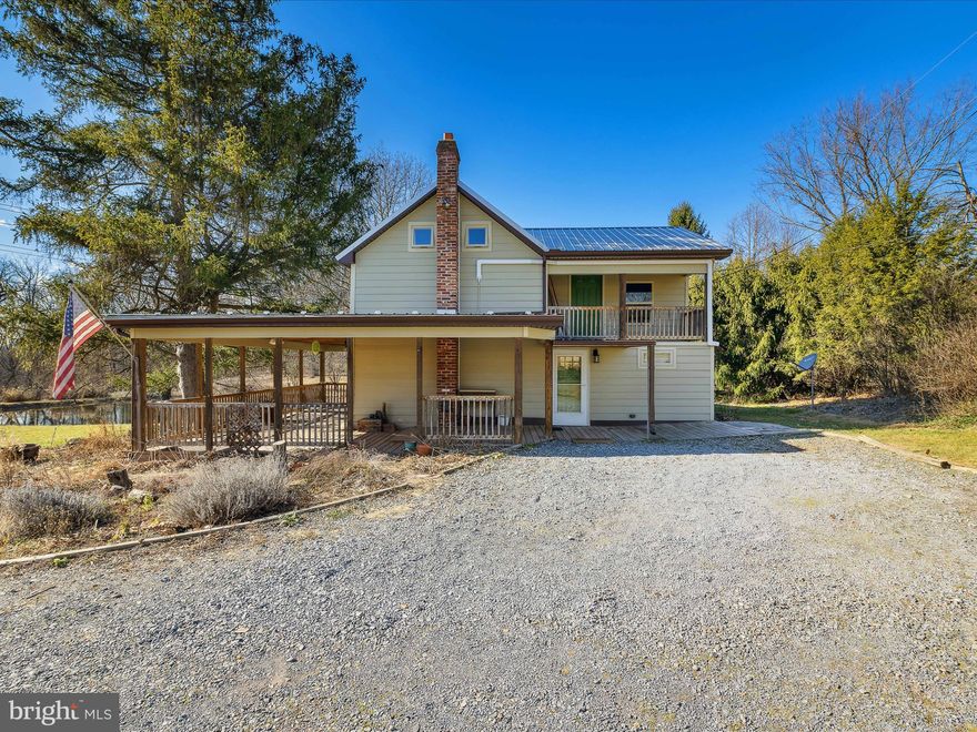 MINI FARM or RETREAT : don't miss this one. This can be your mini farm or a retreat getaway. This 14.058 unrestricted acres with a Farmhouse featuring 2-bedroom, 1 -1/4 bathrooms, living room, kitchen & dining area. Home exposes some of the log features of the original home structure. Gather around the woodstove on those cold days & nights. View of the Pond from the house & porch are just a finishing touch. This property has a large outbuilding for all your toys and equipment. Bring your horses, have some farm animals and grow your vegetables of choice. This could be your homestead/hobby farm for sure. Property has been divided into 3 parcels with multiple perk tests on file with county. Property also has two wells. Build several homes for the family or sell off some parcels if you choose. Great mountain views from several locations / building sites on the property. The possibilities are endless with this one so don't miss out.