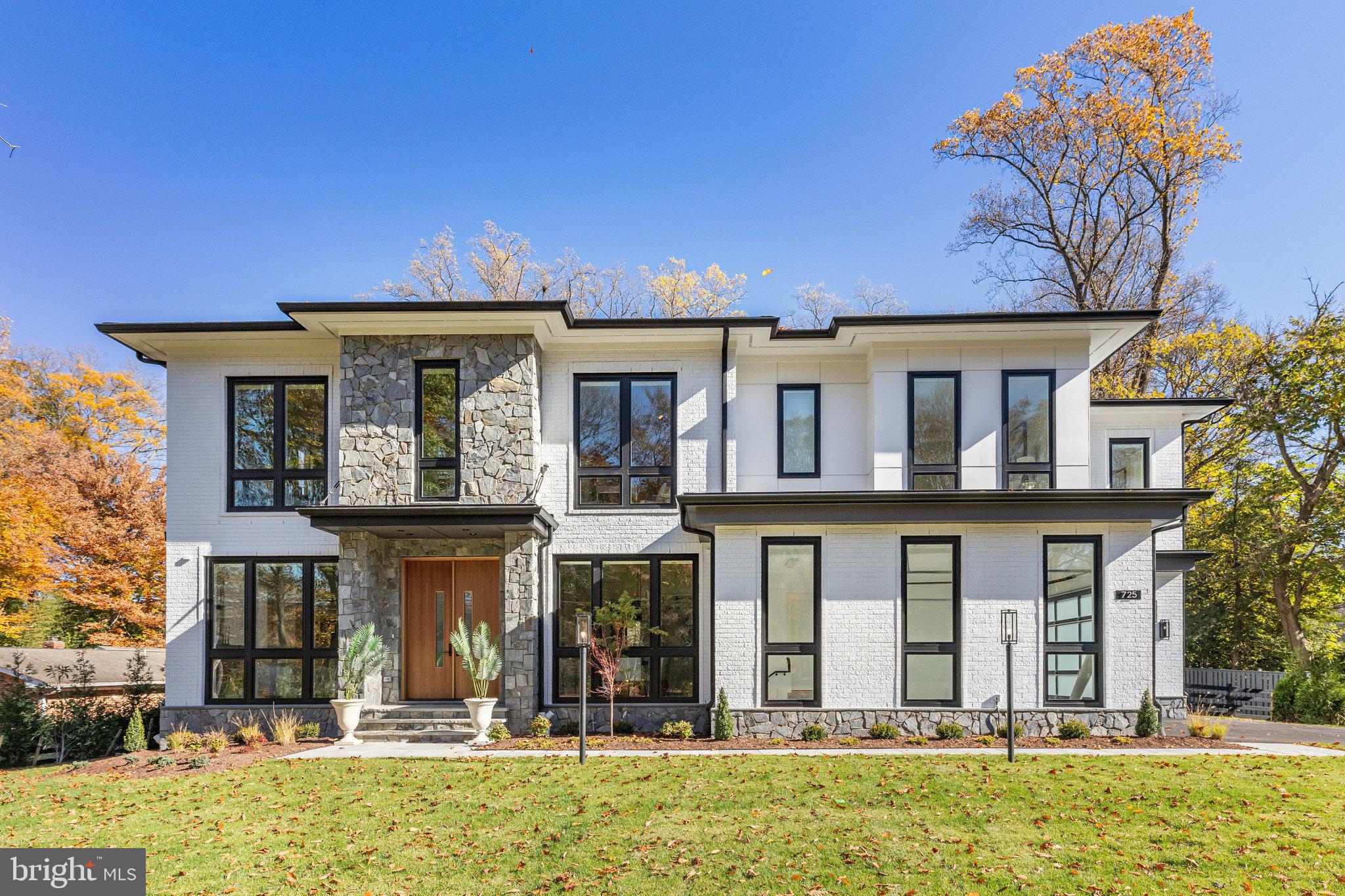 New Luxury Home-Ready to move in! This stunning property features a striking glass pocketing door that opens to a covered porch with a cozy fireplace, electronic screens, and an extended open deck perfect for entertaining. The fully equipped outdoor kitchen adds to the home’s allure. Enjoy a private balcony off the primary bedroom, four fireplaces throughout, and three wet bars for convenience. The executive chef’s kitchen is a true highlight, complemented by soaring 11-foot ceilings on the main level.
Nestled in McLean, minutes from downtown, Tysons Galleria and Washington D.C., this masterfully constructed home boasts over 10,800 sq ft of sophisticated indoor and living space, including garages. Spanning three levels, it features two covered porches, a spacious deck, and a beautiful yard, creating an oasis of outdoor elegance and comfort.
Crafted by Premier Homes Group, renowned for their custom-built homes, this property is a testament to contemporary design and luxury. Its striking exterior combines brick, bluestone, high-quality fiber siding, and sleek floor to ceiling modern windows and doors, presenting a unique architectural statement.
Inside, the home is a blend of luxury and functionality, with a meticulously designed interior that prioritizes both style and comfort. You are welcomed by an expansive foyer that leads into various opulent spaces. The gourmet kitchen, a chef's dream, is equipped with custom cabinetry and high-end appliances.
The primary suite is a lavish sanctuary, featuring a cozy sitting room, fireplace, wet bar, private porch, and a spa-like marble bathroom with dual water closets. The lower level is designed for leisure and relaxation, featuring a full wet bar, a bedroom with an en-suite bath, a dedicated exercise room, and an exquisite home spa with a sauna and steam shower. Additionally, the home is equipped with a generator for uninterrupted comfort.
Experience luxury living redefined in this exceptional new construction home, where every detail is a testament to elegance and high-quality craftsmanship.