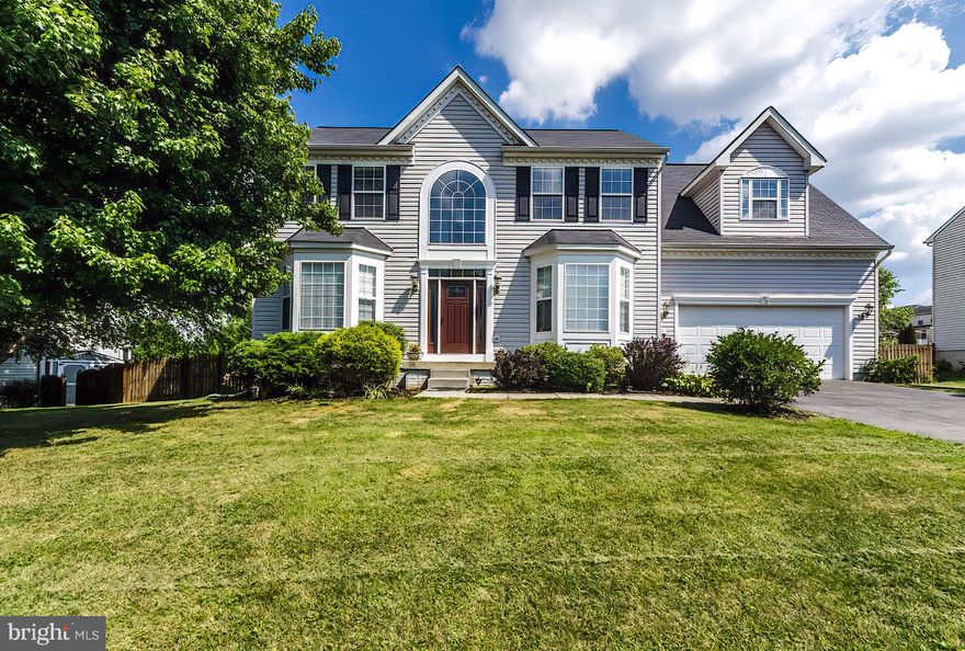 Unique features begin at the front door - custom designed with operable sidelights and reinforced locking, and continue with beautiful hardwood floors, newly upgraded counter tops, and a custom fireplace mantle and feature wall.  This four bedroom, three bathroom property has been well maintained and is move-in ready - sited in a sought after commuter neighborhood, featuring mature landscaping and a community playground.   Recent 2020 renovations include new roof and gutters, new HVAC system on main floor and partially finished basement, new water heater, new granite kitchen counter.  Extend your lifestyle on the huge deck (30x16) in a fenced back yard, testing your green thumb with raised bed gardening in full afternoon sun.  Active radon mitigation system is installed and seller is providing a one-year home warranty.