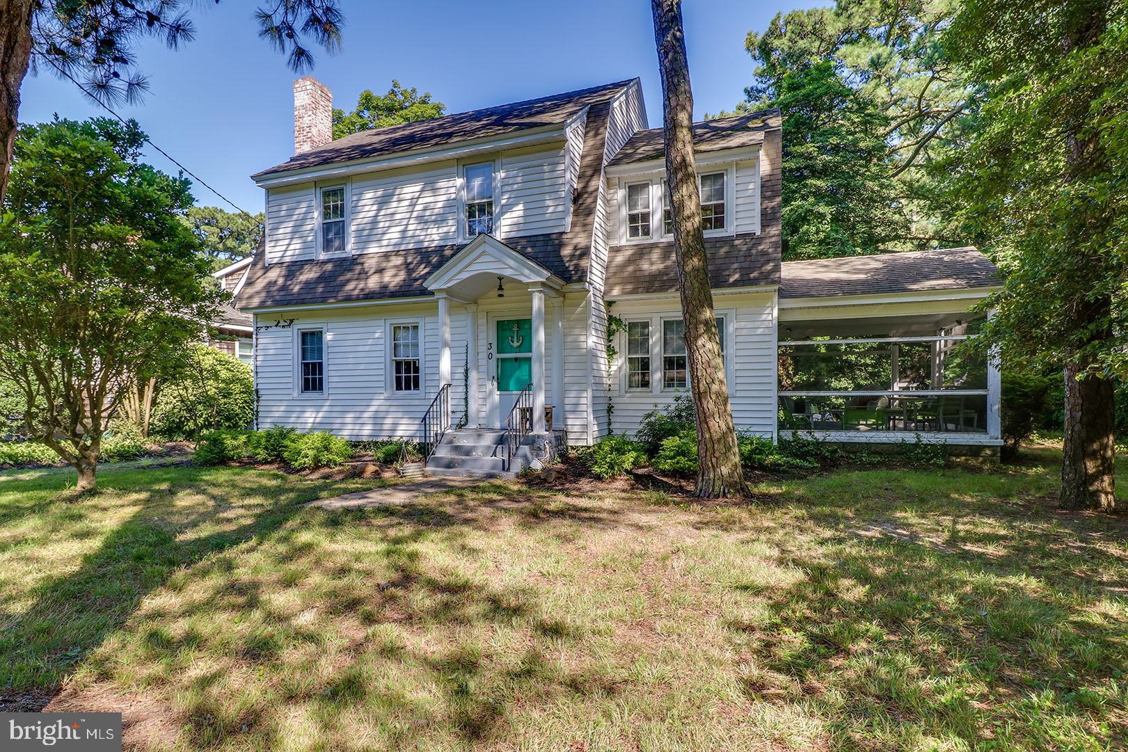 Rare opportunity to own a 75’x 100’ parcel on one of the most sought-after locations in The Pines - Park Avenue. Perfectly positioned in the ocean block and just a short distance from the beach. This location offers excellent proximity to the boardwalk, restaurants, and all of Rehoboth’s amenities. This 1930’s cottage is surprisingly spacious and offers great potential. Upon entry the home features a large family room complete with a wood burning fireplace and high ceilings for a home of this age. Adjacent to the family room you will find a large flex space that is currently being used as a 5th bedroom, but appears to have been a study or den in the past. As you walk to the rear of the home you will find an eat-in kitchen that connects to a large formal dining room. A beautiful curved staircase decorated with an intricate railing guides you to the second floor where you will find 4 spacious bedrooms, a full bath and a walk-up attic. With a screened porch, beautiful mature trees and a detached garage, 30 Park Avenue offers many possibilities, but most important, a superb location!
