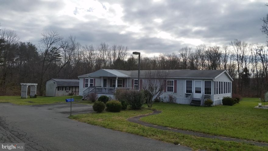 20 yr old doublewide modular home. Supersized with added sunroom. Priced for a quick sale. Gain immediate value. Brand new hot air furnace. Included in sale is Washer / Dryer / Kitchen refrigerator.