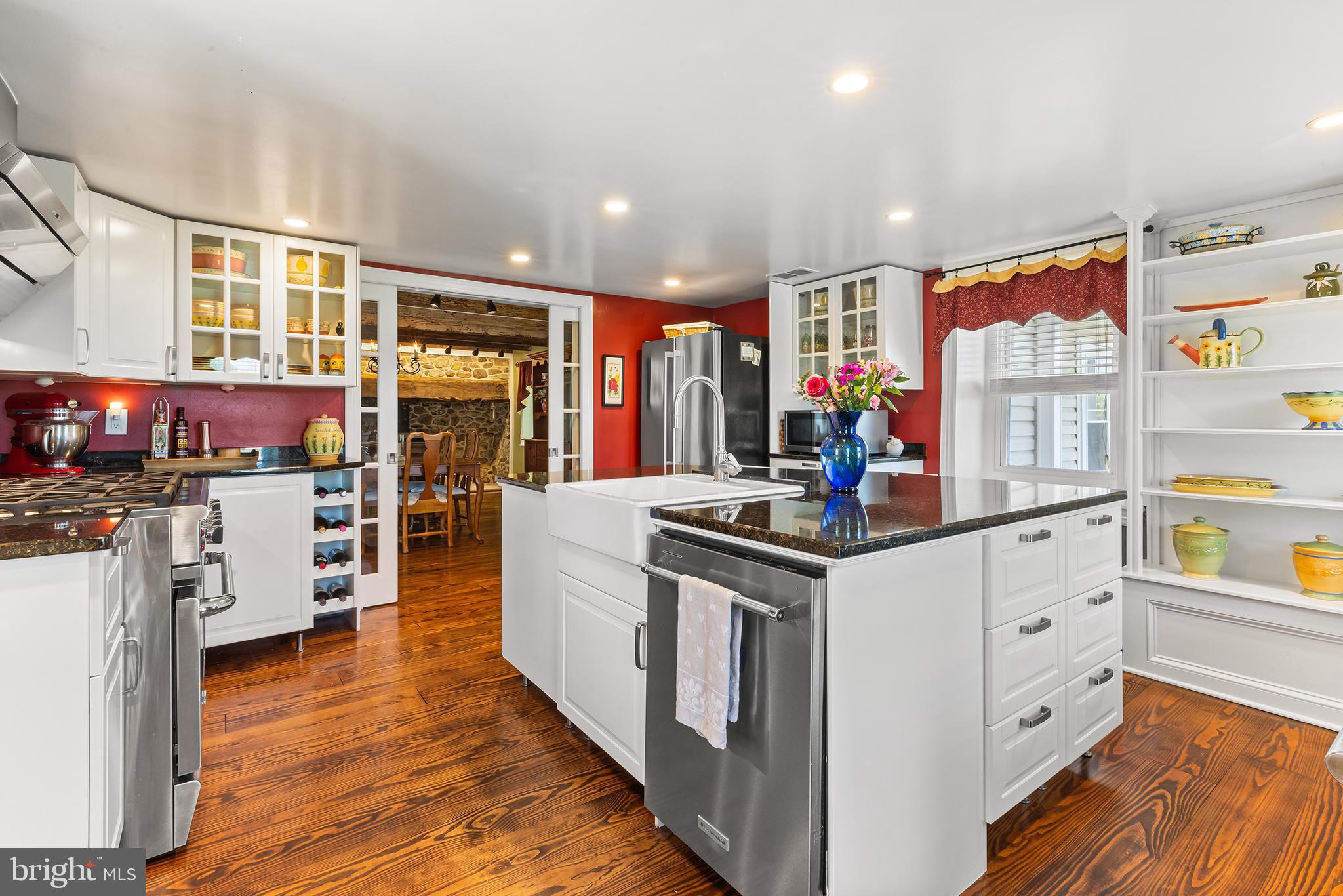 Historic Charm Meets Modern Comfort in the Heart of Charlestown Township.
Surrounded by more than 75 acres of preserved open space, this exceptional 4-bedroom, 2.5-bathroom stone farmhouse offers the perfect blend of timeless charm and everyday convenience. Set on 2.49 beautifully landscaped acres in Malvern, the home features thick stone walls, sunlit rooms, and original architectural details thoughtfully enhanced with modern updates.
Inside, the inviting layout showcases exposed wooden beams, hardwood floors, and a stunning stone fireplace that anchors the warm and rustic dining room. The contemporary kitchen is a culinary dream, with granite countertops, sleek finishes and generous natural light pouring through oversized windows.
Upstairs are three large bedrooms, a full bath, and the conveniently located laundry in large hallway. The upper level features a charming loft area, perfect for a cozy reading nook or a serene workspace. Just outside the main bedroom it offers a peaceful retreat where you can unwind and enjoy the stunning views of the lush landscape outside. The main bedroom is spacious, highlighted by rich wood floors and adorned with elegant décor. Here, you’ll find ample storage with additional closet space. The en suite bathroom showcases modern upgrades, including a stylish vanity and a window that fills the space with sunlight, creating a warm and inviting atmosphere.
The spacious grounds include a large two-story barn and multiple outbuildings, offering flexible studio, office, gym, or hobby space options. Mature trees, open lawns, and abundant wildlife provide a serene backdrop, ideal for relaxing or entertaining.
Outdoor enthusiasts will appreciate the paved walking trail just across the street and direct access to the Horseshoe Trail, which is perfect for hiking, biking, or horseback riding.
This is more than just a home; it’s a peaceful retreat where history, nature, and modern living come together. Enjoy the tranquility of the countryside just minutes from major highways, shopping, and dining.