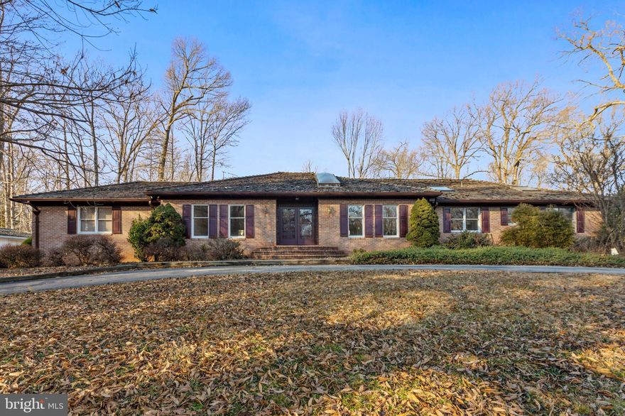 Looking for space to spread out inside AND out? This unique Property affords privacy, peace & proximity! Set on 2 lots that add up to a two-plus acre Retreat with easy access to Ox Rd and Fairfax County Parkway. Sprawling brick Rambler presents a sense of spaciousness that incorporates the full dimension of the main level. Noteworthy-sized rooms throughout loaded with natural light (skylights), hardwoods and architectural interest. Lots of nice amenities in place but primed and ready for more updated touches to make it splendidly yours! Huge walk-up Lower Level with Recreation (2nd fireplace & Wet Bar) and FOUR bonus rooms: overnight guests (full bath access), fitness, hobbies, office, workshop and more. Ample closets and pantries throughout if storage options is high on the list. Stroll the grounds and envision the serenity and calm enjoying the in-ground pool, expansive open Patio and the massive yard for fun and games. Picture the endless possibilities offered in the detached 1716 sq ft Garage (front and back garages that can hold up to a total of 7 cars.) The excitement grows as you explore more - come take a look.
