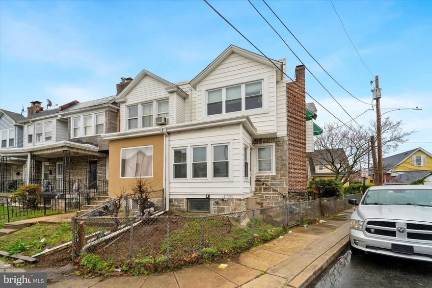 Welcome to 7250 Radbourne Rd – a spacious 3-bedroom, 2-bathroom end-unit row home in Upper Darby Township, brimming with potential! This bank-owned property offers a unique opportunity for buyers ready to bring their vision and make it their own. Step up to the charming covered front porch and enter into a generously sized family room featuring a classic brick fireplace—perfect for cozy evenings. The adjoining dining room boasts a decorative chandelier and opens to a functional kitchen with oak cabinetry and neutral countertops. Upstairs, you’ll find three well-sized bedrooms and a full bathroom. The rear of the home features a stone façade and a second covered porch, providing additional outdoor living space. Parking is available in the rear alley, and a full basement offers ample room for storage or future finishing possibilities. Buyer is responsible for the U&O inspection. Home is being sold in as-is condition. Don’t miss your chance to restore and personalize this end-unit gem in a convenient location!