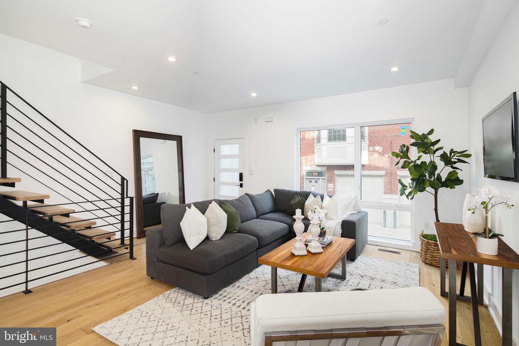Welcome to the Royal Townhomes at Kater Street! Seven amazing new construction townhomes just a block off South Street's many amenities. Each home features a 10 year tax abatements plus two car garage and is located in the desirable Greenfield School Catchment. As soon as you enter you will be greeted by the warm, wide plank white oak floors that can be found throughout the home. To your left is the bright and spacious living room and open concept dining area to follow. The kitchen boasts a Sub-Zero & Wolf appliance package with a stunning built in refrigerator, drawer microwave, and 6-burner gas stove top with plenty of counter space on the gorgeous quartzite countertops. Down the stairs is a fully finished basement that would make for a lovely home office or playroom with an additional half bathroom adjacent and a door to the two car garage with rear access. The second floor hosts two spacious spare bedrooms with large closets and lots of light, as well as a shared hall bathroom and laundry room. Walk up the stairs and enjoy a cold drink at the wet bar on your way to your primary bath with a double sink vanity and a water closet. To your left is the primary bedroom with a walk in closet and huge windows. Last but not least is the roof deck with a green roof area. These homes are one of a kind new construction...Don't miss out on your chance to own a home in Graduate Hospital with 2 car parking!! **Taxes are estimated**