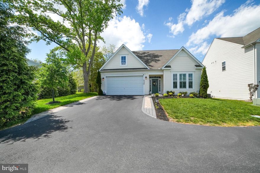 Offers Due Monday 5/5 by Noon. Welcome to 6247 Woodcrest Drive—a rare opportunity to own a beautifully maintained 2018-built rambler in the highly sought-after Woodbrook subdivision of Ellicott City. Tucked away on a quiet street with a private drive, this exceptional 4-bedroom, 3-bath home is surrounded by lush mature trees, offering privacy and serenity just minutes from all the conveniences of Columbia, Ellicott City, and Elkridge.
From the moment you step inside, you’ll be impressed by the attention to detail and care poured into every square inch of this home. The heart of the home is the open-concept kitchen and dining area—perfect for entertaining and everyday living. This bright and inviting space flows seamlessly to the living area and out to a deck, ideal for relaxing with a cup of coffee or hosting summer BBQs with views of nature all around.
The expansive primary suite is a true retreat, featuring custom built-in closets and drawers, and a spa-like en suite bath with a luxurious walk-in shower. Two additional generously sized bedrooms on the main level include custom closet organizers, and a second full bath completes the main floor.
Downstairs, the fully finished basement is just as impressive as the upper level. The spacious recreation room offers endless versatility—think movie nights, or game day gatherings, You’ll also find a legal fourth bedroom, a third full bath, and plenty of storage space.
With its prime location—just minutes from Costco, Trader Joe’s, Wegmans, and with easy access to routes 100, 108, 175, and I-95—this home is perfectly situated for commuting to both Baltimore and Washington, D.C.