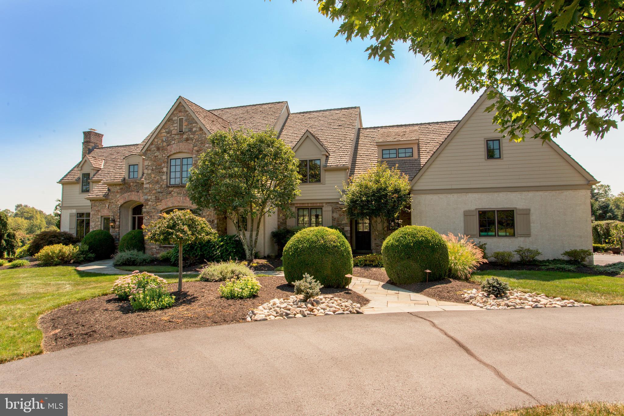 Prepare to be captivated by this extraordinary estate encompassing approximately 5,400 square feet of sheer opulence on a sprawling 1.8-acre landscape. Boasting 5 bedrooms, 4 full bathrooms, and 2 half bathrooms, along with a 3-car garage, this residence is the epitome of luxury living.
Privately nestled amidst breathtaking scenery, this custom John Arrow masterpiece leaves no stone unturned in its pursuit of unparalleled grandeur. Every inch exudes sophistication, with meticulous attention to detail evident in every corner.
As you step through the grand entryway, the soaring ceilings welcome you with open arms, drawing your gaze towards the living room adorned with walls of glass, offering a seamless connection to the numerous terraces that grace the property. A home office, complete with a wood fireplace and a separate entrance, provides the ideal retreat for productivity and tranquility.
Indulge in decadent dining experiences within the formal dining room, steeped in tradition and elegance, having played host to years of fine dining memories. Culinary enthusiasts will be delighted by the chef's kitchen, featuring top-of-the-line Subzero and Thermador appliances, a commercial-grade gas cooktop, double wall ovens, and ample prep space. The adjacent sunken family room, with its spectacular wood fireplace, provides the perfect backdrop for relaxation and gatherings.
Ascend the grand staircase or the back staircase to discover the bedroom floor, where the primary suite awaits to enchant you. Featuring spacious sitting rooms, an expansive walk-in closet, and a sumptuous master bath complete with a soaking tub overlooking the stunning grounds, a walk-in shower, and a double sink vanity, this sanctuary promises ultimate relaxation.
Additional luxuries await on the lower level, including a billiards room, sauna, workout room, full bathroom, and a bar area, perfect for entertaining guests or unwinding in style. Warm summer evenings beckon you to the bluestone patio, where you can relax under the pergola overlooking the tranquil coy pond and magnificent pool. And for the sports enthusiast, indulge in friendly games on your very own basketball court!
Nestled in a picturesque neighborhood, this home is the epitome of perfection, offering an unrivaled lifestyle of luxury and comfort. Prepare to be mesmerized by the sheer splendor of this stunning residence, where every detail has been thoughtfully curated to create an unparalleled living experience.
