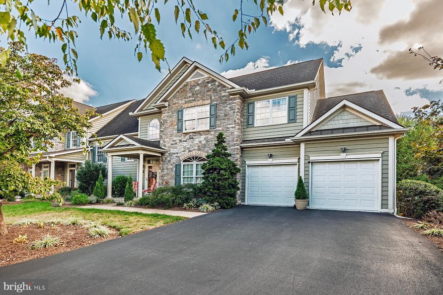 This is it! If you’re looking for a grand villa with all the bells and whistles, look no further. This immaculate, one-owner home showcases beautiful hardwood floors and exceptional attention to detail throughout. Enter the welcoming foyer and step into a spacious living room featuring a double-sided fireplace that flows seamlessly into the sunroom.  The main-level primary suite offers custom cabinetry, a walk-in shower, and a large walk-in closet with built-in organization systems. The gourmet eat-in kitchen is a chef’s dream, complete with a center island and custom cabinetry. A convenient first-floor laundry room and a formal dining room with upgraded custom moldings, including triple crown, add to the home’s elegance. Upstairs, you’ll find built-in desks—perfect for a work-from-home setup—along with additional bedrooms featuring walk-in closets and storage systems, including a third bedroom with its own full bath. The home offers four full bathrooms in total. The spacious lower level includes a full walkout to a beautiful stone patio and provides flexible space for a family room, exercise area, or fourth bedroom, along with two large storage rooms. Enjoy outdoor living with a large deck just off the sunroom—perfect for grilling and entertaining. Situated on a premium lot, this property is surrounded by trees, offering exceptional privacy and a serene setting.