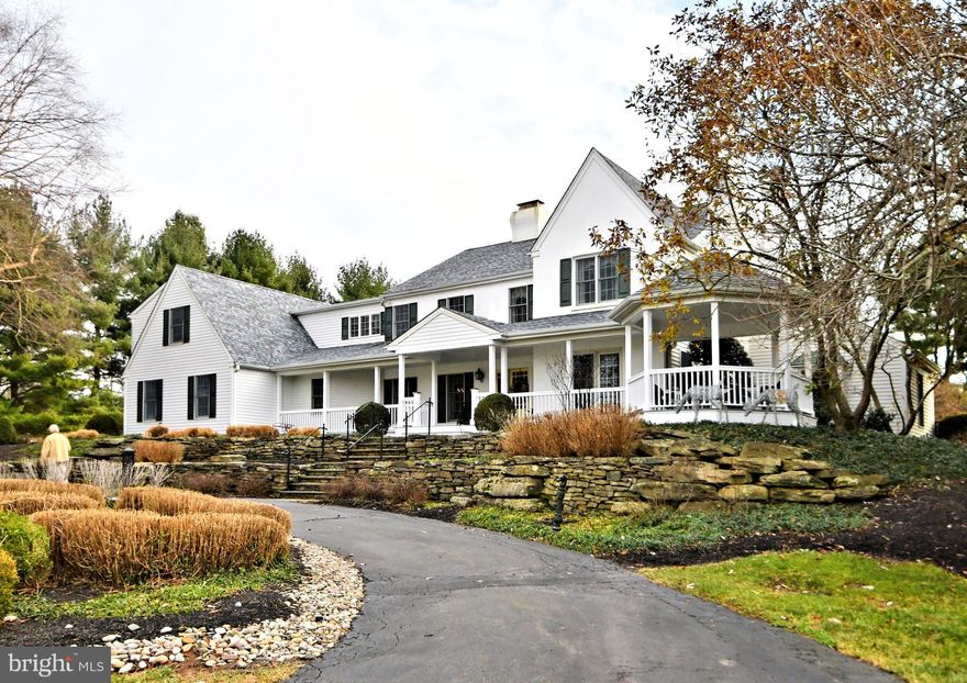 A long winding driveway leads over a small bridge to this magnificent home situated on a ten acre parcel! Enjoy long distance views, professionally landscaped gardens and circular driveway supplying ample parking for guests! Enjoy  relaxing on the full wrap around porch  while taking in those peaceful long distance views. This home has been completely remodeled and expanded during this homeowners tenure.
Enter to a 2 story hardwood foyer with turned staircase, to the left and right are the formal areas of the home, the dining room and formal living room with fireplace. Each perfect for entertaining! To the rear of the home is a large remodeled kitchen with center island and premium appliances. Adjacent, a breakfast room with large Colonial walk in wood burning fireplace and walls of windows and atrium doors overlooking the rear grounds! Enter to an extremely welcoming family room / great room with wall to wall gas fireplace, custom bar for entertaining and with plenty  of natural sunlight filtering in from the windows. This home features a first floor 2 story study, with custom built ins and convenient back staircase. 1st floor laundry, mud room, powder room and 3 car side entry garage complete this level.
Above, are 5 bedrooms, including a large master suite with plush carpeting, fireplace, private rear staircase to the 1st floor library, 2 large walk in closets and remodeled private bath with soaking tub. The 2 additional bedrooms have private baths and then there is an additional hall bath to service the additional bedrooms.
Below is a full unfinished basement with crawl space. 
The magnificent rear yard features a custom inground pool with spa, pergola, slate walkways, fencing, pool house and spectacular landscaping! Perfect for summertime entertaining!