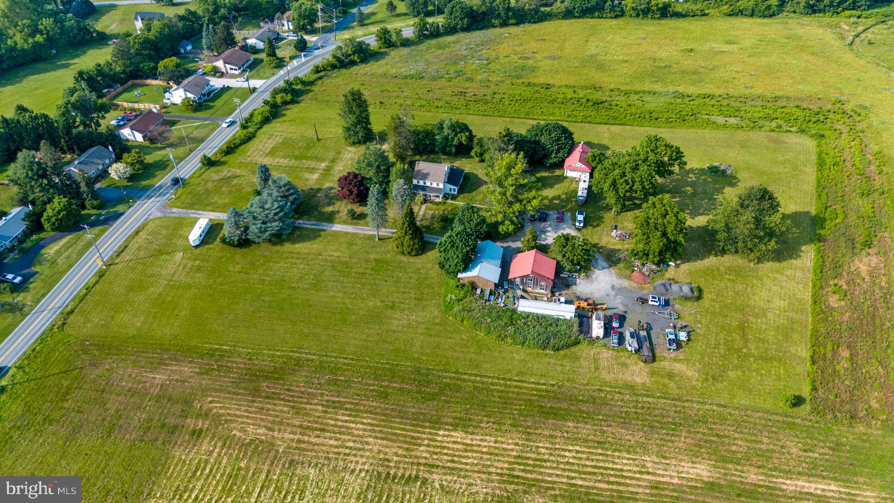 The 2,256 SFT farmhouse was built in 1850 and is ideal for business or residence. The home sits on a unique 5.3 acre property zoned in the Industrial/Professional Office Research District. Public water, gas, and sewer available. 4 bedrooms, 2 full baths, a walk-up attic that was previously divided into bedrooms for a boarding house, and a full basement with a walkout. 4-zoned for HVAC. 208V 3-phase power. First floor has central air. New Thermopane windows and doors. New macerated pressure pump for the septic system. House has its own separate electrical meter.
An electrical transformer on site powered by 15kVA line providing 208V 3-phase power to the entire property. The property has 375 feet of road frontage and has three additional garage/warehouses on the property that are 2000 SFT each, for an additional 6000 SFT of warehouse/shop space with garages.
All 4 buildings have 3 phase power and water. Public sewer and gas on street. Public water connection is next street over on Stoney Run.
In addition to the main farmhouse, you will find three additional outbuildings:
#1 Outbuilding Machine Shop – 2000 SFT building approx
6” concrete floors, 12 ft ceiling in ½ the building and 18 ft ceilings center of roof
2 garage doors
208V 3-phase power
Water and heat pump with a back up HVAC system
Has shared electrical meter with Building #2
#2 Outbuilding Warehouse and Machine Shop – 2000 SFT building approx
Low ceiling 7’3”, Tall ceiling 15 ft
Heating system HVAC heat pump on 2nd floor
208V 3-phase power, water and heat
Fired oil backup heater
Two garage doors
2nd floor is L-shaped
Has shared electrical meter with Building #1
#3 Outbuilding Warehouse – 2000 SFT building approx
Heat and AC
Garage door
208V 3-phase power, water and heat
Walkup attic
Has its own separate electrical meter.
This 5.3 acre with industrial/professional zoning encourages well-planned industrial, commercial, and residential uses. Please verify with the township for your specific use. For your convenience, please see the attached uses for PO-Industrial/Professional Office Research District for East Vincent Township.
Come and take a tour!