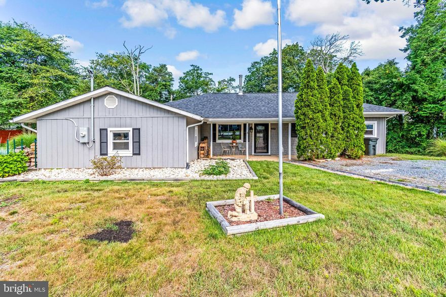 Amazingly redone three bedroom two full bath rancher with upgraded everything.  New wood pellet stove, newer roof, extensive hardscape in the fully fenced back yard, work shop, and a gorgeous view to the water from your back deck.  Bring the boat, the community ramp is right next to your driveway! $25 per year to access the boar ramp.  This Summer could be filled with fishing and food trucks right in your back yard!