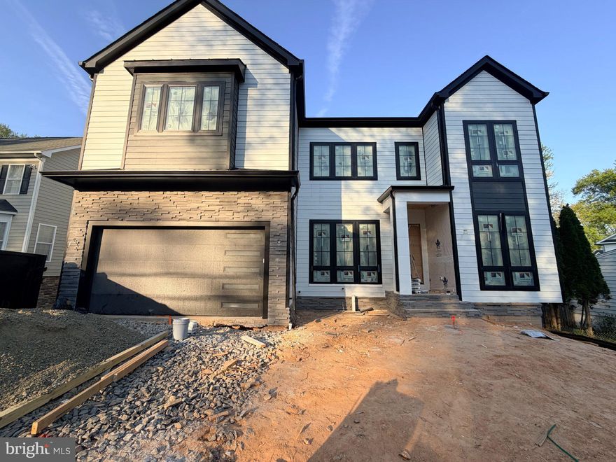 Another exceptional custom residence by Engee Homes, showcasing refined luxury and thoughtful design across approximately 5,500 square feet. This home offers 6 bedrooms, 6 full baths, and 2 half baths in a seamless transitional open-concept layout, with all bedrooms featuring private baths. The main level opens with a foyer leading to an office/study and a formal dining room with a butler’s pantry. The family room, centered around a cozy fireplace, opens to a screened porch for a seamless indoor-outdoor flow. The gourmet kitchen is appointed with high-end appliances, custom cabinetry, and a statement island with dual waterfall features, with direct access to an open deck. A secondary bedroom with full bath, powder room, and a mudroom lead to a two-car garage equipped with an EV outlet. The upper level features a primary suite, three additional bedrooms, and a family loft, offering flexibility for both everyday living and entertaining.The walk-out lower level is designed for entertaining and extended living, featuring the sixth bedroom with full bath, a theater room, fitness room, wet bar, additional half bath, and ample storage, with access to the lower outdoor living area.
Engineered hardwood flooring extends throughout all three levels, and the home is elevator-ready. Estimated delivery May 2026.