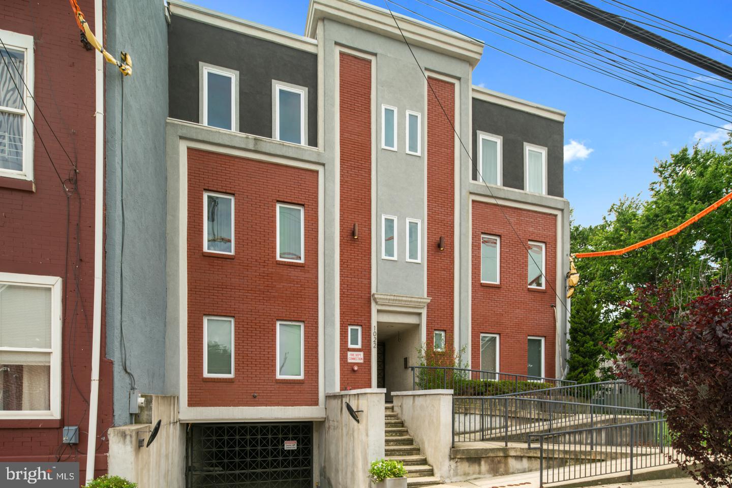 Lovely, immaculately maintained condo in Northern Liberties. Assigned indoor parking, with a balcony for outdoor space that flows from the large living room/dining room area. New Wi-Fi enabled washer and dryer (not in the pictures) and new energy efficient HVAC system installed in 2021. Custom closet systems throughout as well as hardwood floors. Custom wallpaper made for the current owner, but which can easily be taken down if it is not to your taste. Two good size bedroom suites with well-appointed full baths and a half bath for your guests. Updated kitchen with ample amount of cabinet space and good size counter for seating and storage. Roof to the Building recently redone (June 2025) with a 10 year warranty. Located near Broad Street and Fairmount it's accessible to all the amenities in that area. Easy access to Center City, new Aldi within walking distance. Schedule a showing today. SELLER IS VERY MOTIVATED!