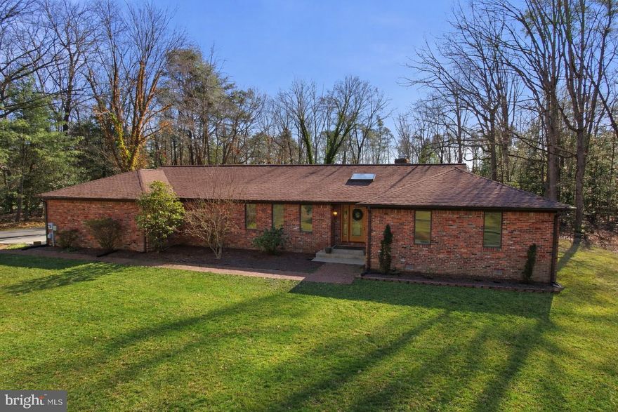 Welcome to this stunning 4 bedroom 3.5 bath  rambler set on 2.46 private acres, offering the perfect blend of elegance, comfort and outdoor living. From the moment you arrive, this beautifully upgraded home impresses with gleaming hardwoods floors throughout and a thoughtfully designed open layout. The heart of the home flows seamlessly into a light filled sunroom, ideal for morning coffee or evening relaxation. Every space has been tastefully updated, creating a move-in-ready home that feels both warm and refined. Step outside to your resort style backyard oasis - and entertainers dream. Enjoy a built-in swimming pool, outside hot tub with a covered bar area complete with a dedicated pool bathroom, making hosting effortless and fun. Car enthusiasts and hobbyist will appreciate the oversized detached 2 car garage along with an additional carport for extra parking or storage.