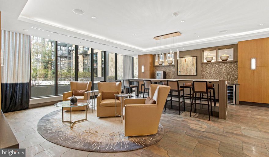 Nestled in the vibrant heart of Bethesda, Maryland, this luxury apartment complex offers an unparalleled living experience that combines modern convenience with sophisticated design. Designed to cater to the discerning tastes of urban dwellers, this property stands as a testament to luxury living, where every detail has been meticulously crafted to ensure the utmost in comfort and style.

*Exceptional Location*
Located in the sought-after Woodmont district, the apartment complex is perfectly positioned as a gateway to the best that Bethesda has to offer. Residents enjoy easy access to a plethora of amenities, including the Walter Reed National Military Medical Center, the NIH, and a variety of shopping, dining, and entertainment options. The prime location also offers convenient access to public transportation, making it easy to explore the wider metropolitan area.

*Architectural Elegance and Design*
The building's U-shaped design opens up to a beautifully landscaped courtyard, offering a seamless transition from the bustling city life to a tranquil oasis. The architecture is both richly textured and humanly scaled, creating an inviting streetscape that residents are proud to call home. A dramatic window wall façade and ground-level duplex units with front porches and planters further enhance the building's aesthetic appeal.

*Luxurious Amenities*
Residents of this apartment complex enjoy access to an array of exceptional amenities designed to enhance their lifestyle. The property boasts a large fitness center, fireside lounges, and a rooftop lounge equipped with bars, fireplaces, grilling areas, and two pools. Additionally, the convenience of having a 50,000 square foot grocery store within the building cannot be overstated. The property is also LEED Gold Certified, reflecting a commitment to environmental sustainability.

*Sophisticated Living Spaces*
The apartments themselves are a reflection of the luxury and sophistication that define the property. With a variety of floor plans, including studios, one to three-bedroom apartments, and townhomes, there is something to suit every preference. Each unit features designer finishes, stainless steel appliances, and spacious layouts that make coming home a pleasure.

*Community and Convenience*
The property is known for its friendly and helpful staff, ensuring that the needs of residents are met with professionalism and care. The well-maintained common areas and the sense of community fostered among residents make this complex more than just a place to live—it's a place to belong.

This luxury apartment complex in Bethesda, Maryland, offers an unmatched living experience for those seeking the best in urban living. With its prime location, architectural elegance, luxurious amenities, and sophisticated living spaces, it stands as a beacon of modern luxury and convenience. Realtors and renters looking for a property that combines the vibrancy of city life with the comfort of upscale living will find everything they desire and more at this premier apartment complex.

** Pricing and availability subject to change on a daily basis ** Photos are of model units ** Parking may be available for additional fee **