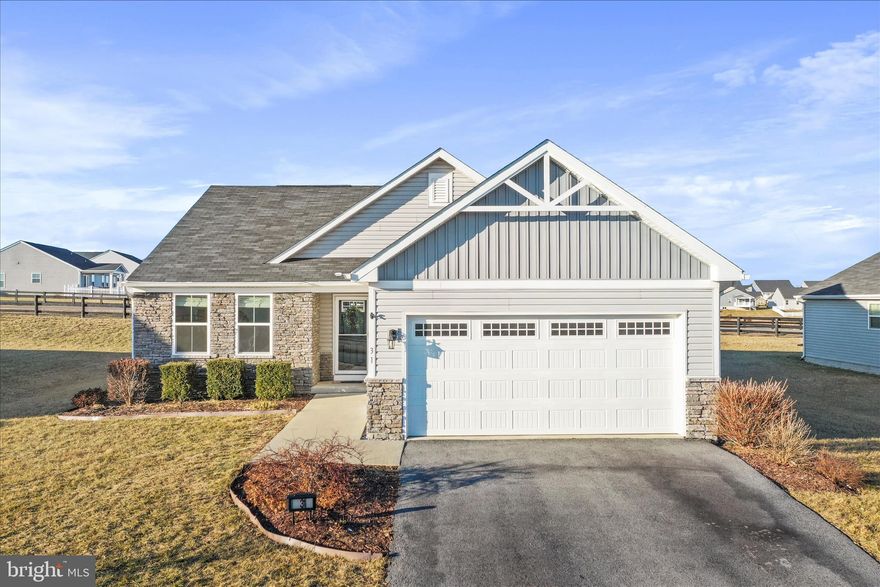 Former model home that still shows like a model! For starters, there is brand new LVP flooring throughout the main level and brand new carpet in all the main level bedrooms. Secondly, the entire home was painted in January 2026. This home is perfect for multi generational living with ample finished living space in the basement that includes a huge recreation room (with a water line already installed in the closet under the stairs for a future wet bar), even bigger bedroom with walk in closet, large flex/media room with walk in closet, full bathroom with a beautifully tiled shower, and storage room. All flooring in basement is LVP. The main level has an open floor plan perfect for entertaining with a granite kitchen island for gathering and conversing with those in the dining and living room. Another thing to love is the epoxy floored garage. This home is move in ready and situated perfectly for those utilizing the VA Medical Facility as well as commuters heading to MD or VA. Super close to restaurants, schools, and shopping.