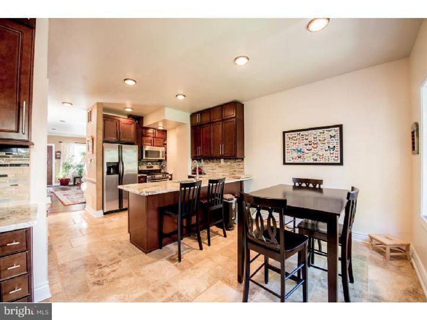 Gorgeous 4 bedroom 2 full 2 partial bath with 2 CAR PARKING and HUGE YARD. Lot's of upgrades and renovations were done over the past 4 years. 1st Floor Has New Hardwood floors, New Kitchen over looking a huge back yard with a deck and New Storage Shed. 2nd Floor has 2 large bedrooms with large closets , washer and dryer nook and a full bath. 3rd floor is the large master suite with large New shower and double sink, sitting area and a walk in closet. The lower level has access from the driveway and garage. It also has a large 4th bedroom  and a half bath. For a full list of upgrades and renovation , see seller disclosure .    --