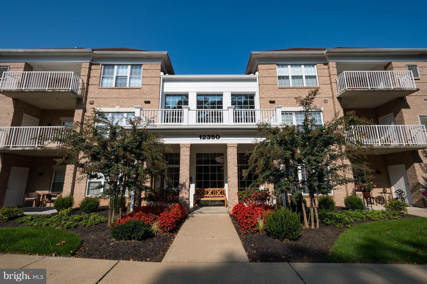Beautiful top floor condo, elevator, open floor plan, kitchen opens to family room, outside covered porch, double closets in foyer, shows like model.