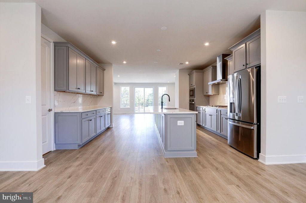 Photo of 42225 Shining Star Square, BRAMBLETON, VA 20148 (MLS # VALO2108362)