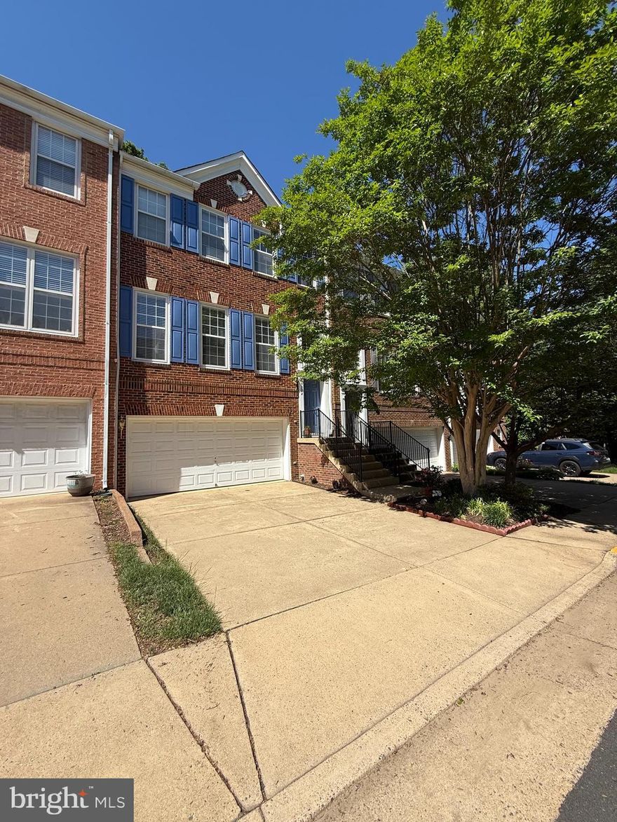 Welcome to this inviting townhome with spacious rooms, garage parking, views to trees and easy access to the Vienna Metro. Enjoy the beautiful, new expansive kitchen featuring wood cabinetry, quartz countertops, gas cooking with exhaust fan, pantry, pendant lights and an island with breakfast bar seating. The Family Room is adjacent to the kitchen and features a gas burning fireplace and windows to green space along the perimeter of the community. Hardwood floors, crown molding, natural light, an open floorplan and deck off of the kitchen are highlights of the main level. The spacious primary suite has a cove ceiling, large walk-in closet and spa bath with soaking tub and standing shower. Two additional bedrooms along with a full laundry room and linen closet can also be found on the upper level. The inviting lower level offers a relaxing Rec Room with a sliding glass door to the private patio and a fourth bedroom and full bathroom make for nice guest accommodations. A two car garage with additional storage and driveway parking complete this townhome. New Roof 2025, New Kitchen 2021, HVAC 2017. The community pool and playground are around the corner and the Metro is a few blocks away. This conveniently located home is move-in ready and awaiting new owners.