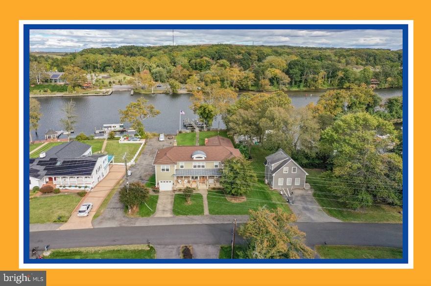 River Life on the Occoquan! Only 6 chances in past 10 years to own waterfront on Poplar Lane. Lucky number 7 is here for you to close out 2023 in Style and with a Big Smile.  Other numbers that define this Scarce Property include 7 boat slip dock conveys,  Deep Water 12' MWL, 80' of Waterfront, 1 Private Boat Ramp, Going North 19.5 Miles to the Pentagon (20-25 minutes), Going South 32 Miles to Fredericksburg, 2 Minutes to I95 Exit 160,  0.4 Miles to Downtown Occoquan - right down Poplar Lane, 20,000 lb boat lift on dock, 1 property away from the Prince William Marina and Electric Palm Waterfront Restaurant, Big Bonus 2 story 40' x 23' with 12' x 12' garage door facing the River. All these amazing features packed into one property, don't miss this opportunity. On your visit notice some nuances like the trees over the dock deck for great shade, the view across the river to Occoquan Regional Park and the Northeast views providing sunrise in back and sunsets in the front. Take your pick, head east out to the Potomac in your Power Boat from your own back yard, or head west in your Kayak to visit downtown or maybe just fish from the dock for Bass and Catfish. We hope you enjoy the photography and on your visit notice some fun further property details designed and built by the owner in 2004, including separate back and front garages, Soaring entryway ceilings with remote blinds, Abundant Kitchen Area with view to the River, Owner's Suite with window facing sunrise on the River, Hardy Plank Siding, 2 x 6 Construction, sliding board off dock, Trex deck with covered and uncovered areas, front porch, front parking, rear parking, and so much more to discover on your visit! Property is also Pre-List inspected with some minor  maintenance items already addressed.  Looking forward to your Visit!