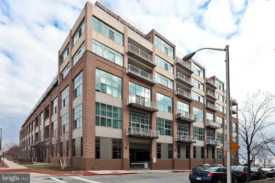 Sophisticated 3 bedroom 2.5 bath condo in Canton Cove.  Enjoy 17' ceilings, tons of closet space, hardwood floors, stainless appliances, updated bathrooms, gated parking, 24 hour desk, and covered outdoor terrace.  3rd bedroom is open loft style and could be open bedroom or family room. Rent includes direct TV.