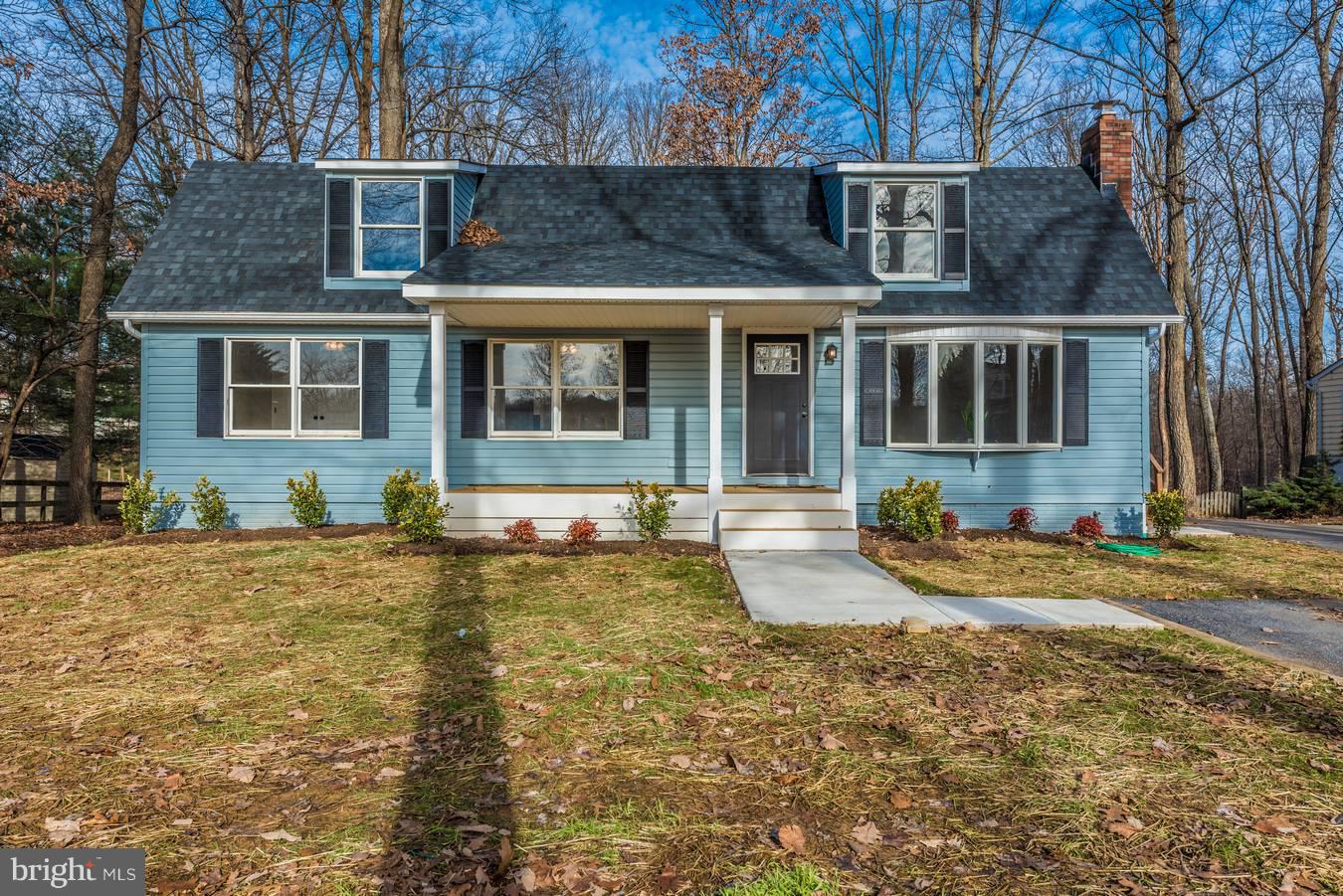 This gorgeous 3 bedroom cape cod has undergone a total remodel. Both the exterior and interior of the house have been newly painted. All doors, both interior and exterior, have been replaced. Also, the house is equipped with a new roof, deck, and sidewalk. The interior has been completely refinished. Inside you will find brand new plumbing features, stainless steel GE appliances, and a new HVAC heat pump system. The new HVAC system offers both heating and cooling. The house has also been equipped with new plumbing, insulation, and drywall. New tile flooring, carpet, and hickory hardwood floors can be found throughout the house. The spacious four bedrooms are perfect for family and those who enjoy company. The basement is finished and spacious making it the perfect space for entertaining. The basement also walks out to a gorgeous wooded yard. The house has received a brand new well and well pump. All work to this home was done by licensed contractors and was county approved.