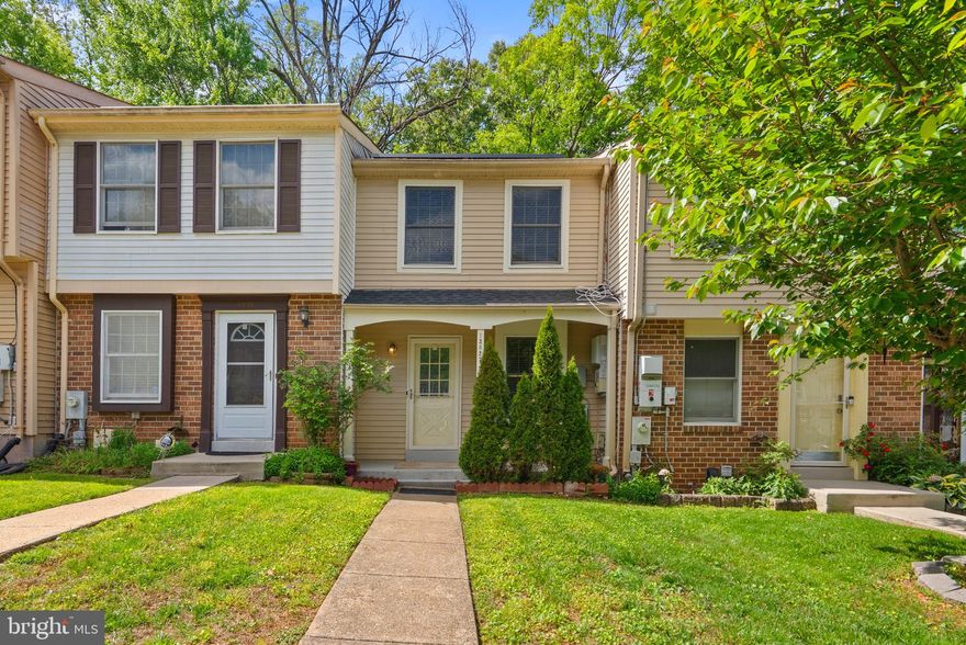 Welcome to this beautifully updated, move-in-ready 3-level townhome offering the perfect blend of comfort, convenience, and value. Freshly painted throughout with brand-new flooring on the main and upper levels, this home is ready for its next owner to enjoy from day one. The main level invites you in with a charming front porch and opens to a bright, airy living space designed for both relaxing and entertaining. The well-appointed kitchen features ample cabinetry and a new refrigerator, seamlessly connecting to a spacious deck that backs to trees—perfect for morning coffee or unwinding in a peaceful setting. Upstairs, you’ll find two generously sized bedrooms with excellent closet space and a full bath, providing comfortable and functional living. The fully finished walk-out lower level adds valuable versatility, offering a large recreation area, a second full bathroom, and separate laundry and utility rooms—ideal for guests, a home office, or additional living space. Additional highlights include a newer HVAC system (2022) and dedicated parking with abundant visitor spaces. Located in a sought-after community featuring walking paths, parks, and playgrounds, and just minutes from shopping, dining, and major commuter routes, this home truly has it all.